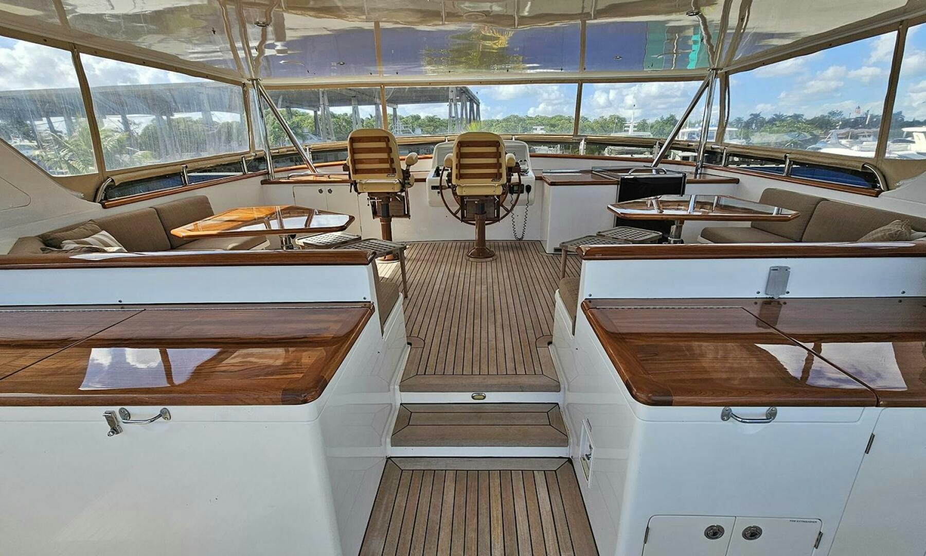 a room with a table and chairs aboard MY KIMBERLY Yacht for Sale