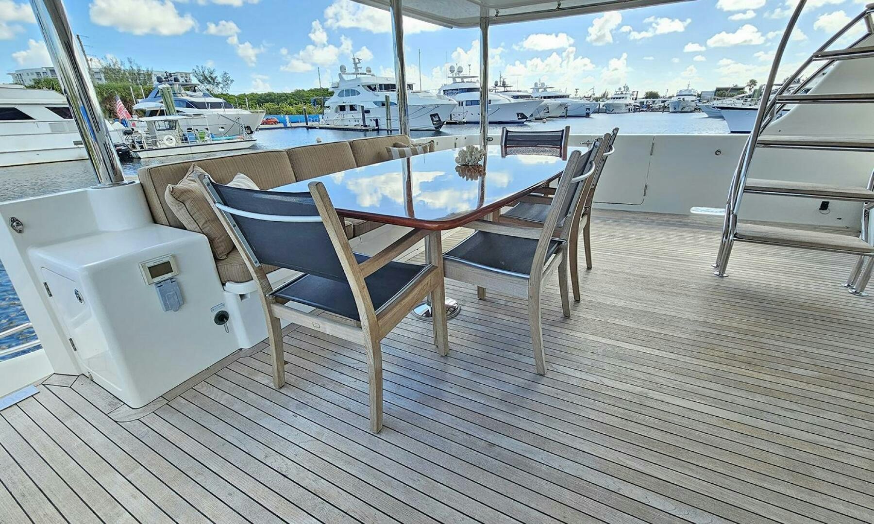 a deck with chairs on it aboard MY KIMBERLY Yacht for Sale