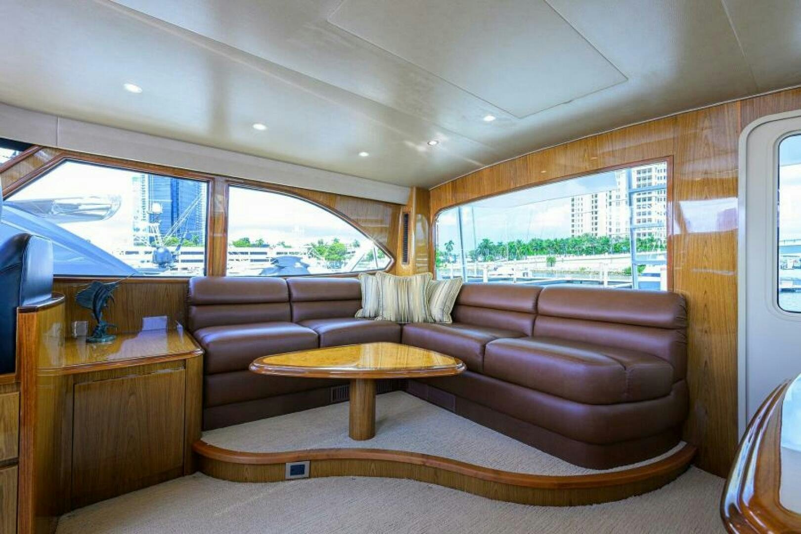 a living room with a couch and a table aboard EGARIM Yacht for Sale