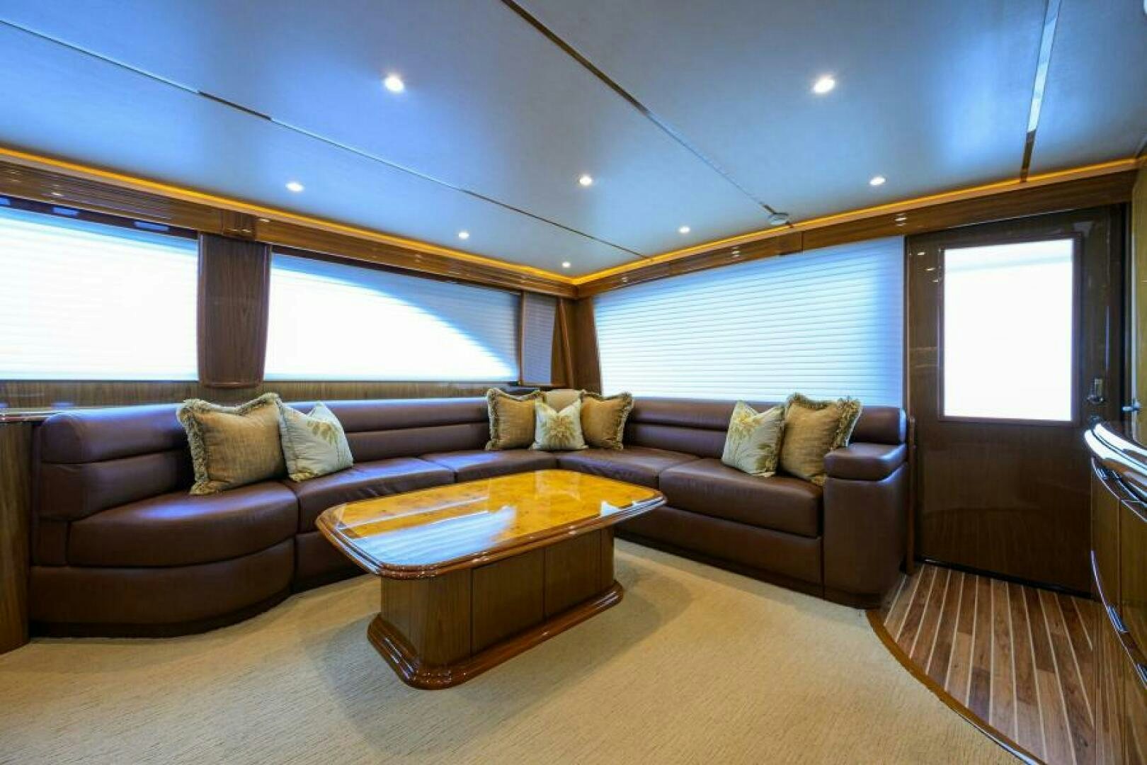 a living room with a couch and a table aboard EGARIM Yacht for Sale