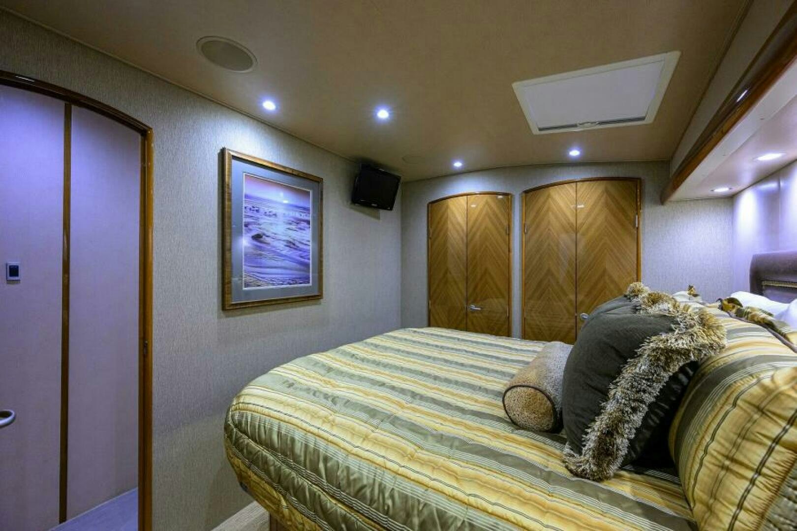 a bedroom with a bed and a window aboard EGARIM Yacht for Sale