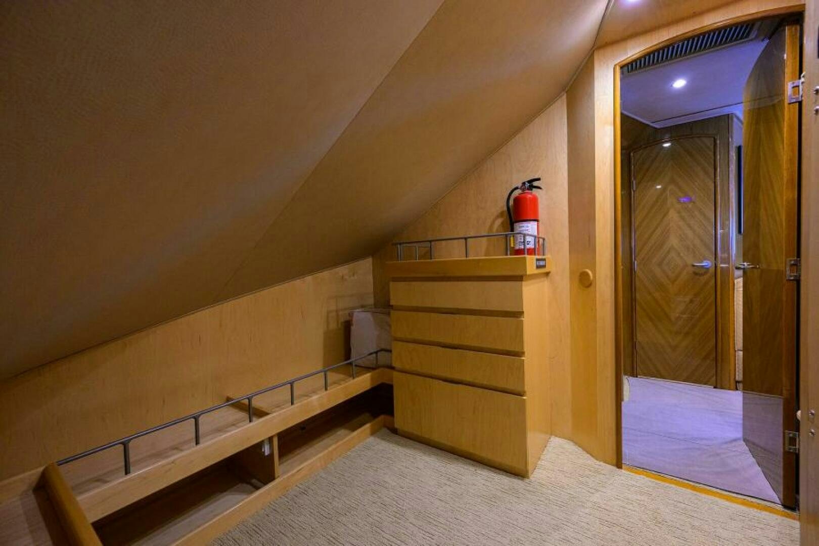 a room with a wood staircase and a wood door aboard EGARIM Yacht for Sale