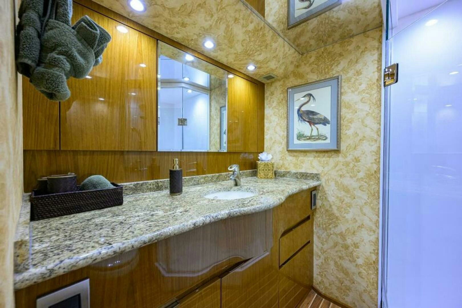 a bathroom with a countertop sink and mirror aboard EGARIM Yacht for Sale