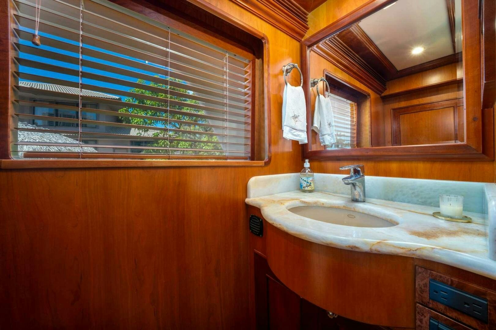 a bathroom with a sink and a mirror aboard BAD-LAD Yacht for Sale