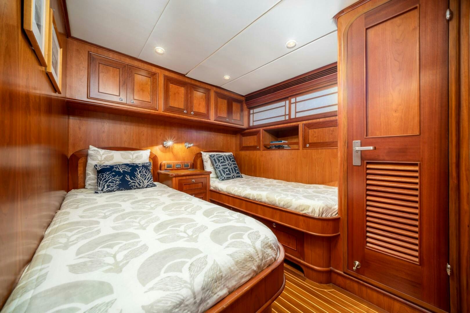a room with wooden furniture aboard BAD-LAD Yacht for Sale