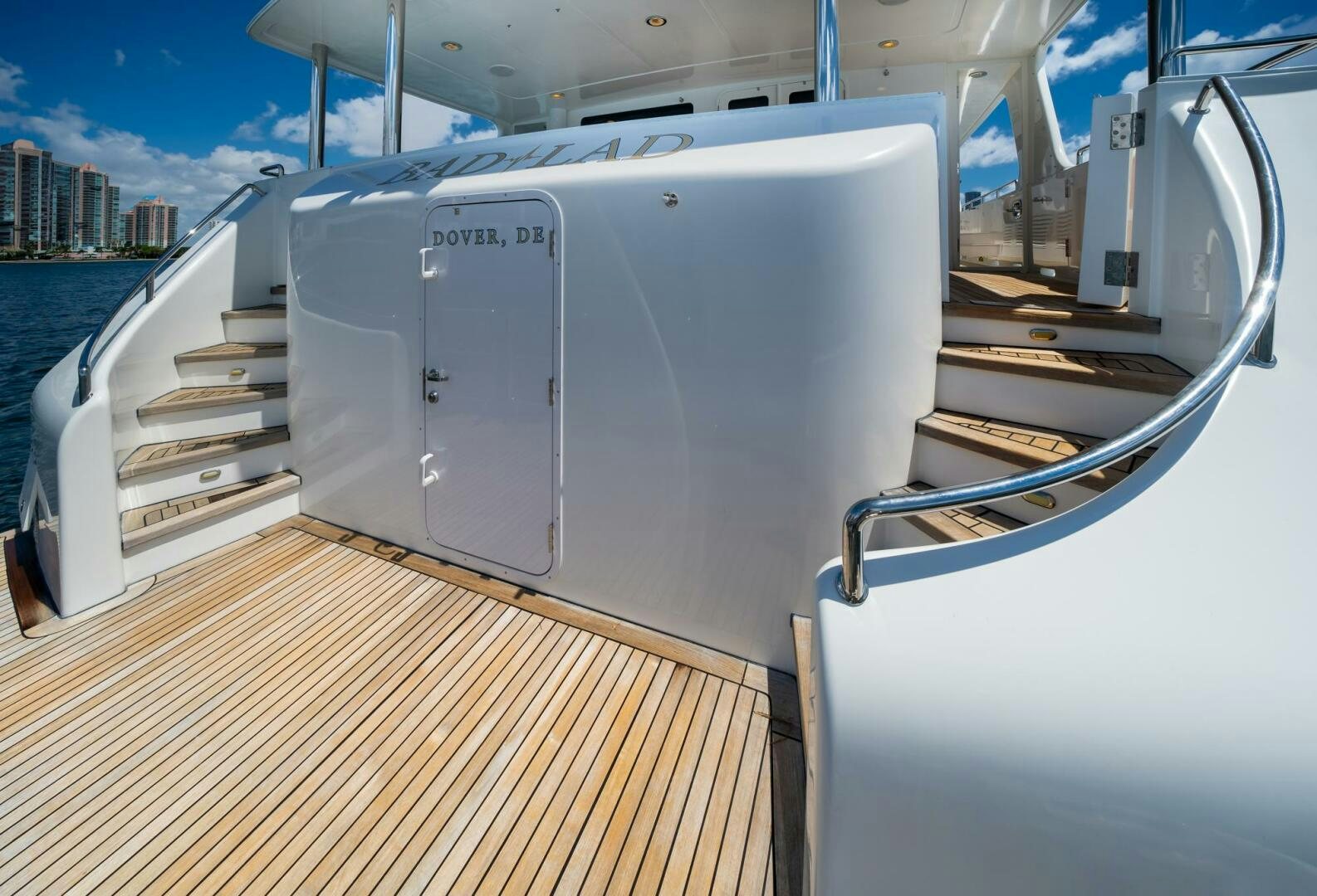 a large white boat on a body of water aboard BAD-LAD Yacht for Sale