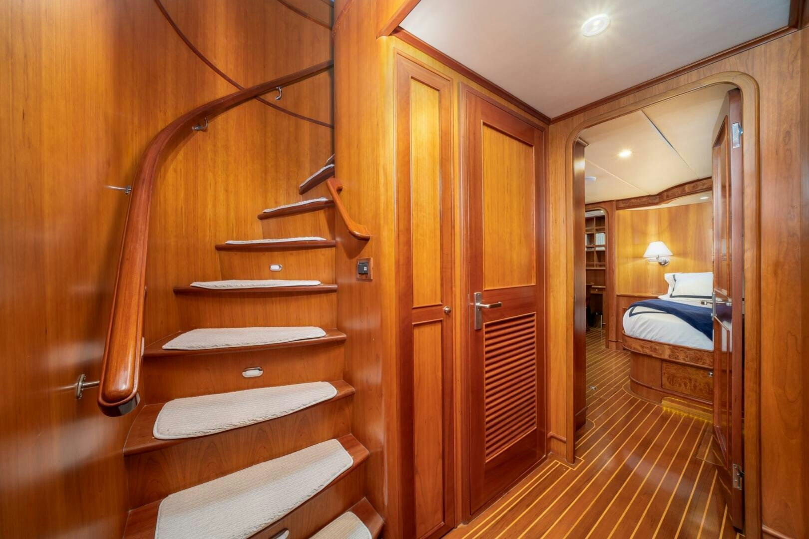 a room with wooden furniture aboard BAD-LAD Yacht for Sale