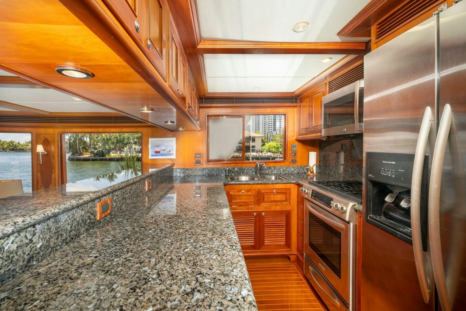 a kitchen with stainless steel appliances aboard BAD-LAD Yacht for Sale