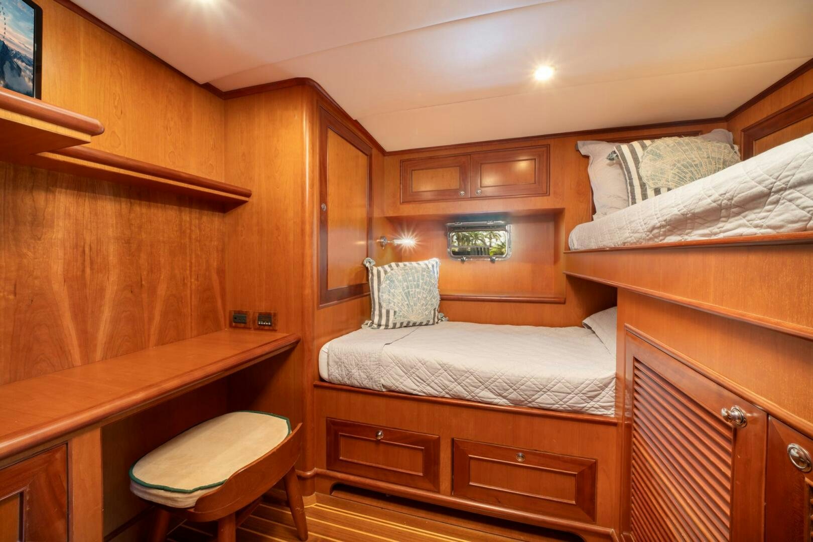 a room with a bed and a desk aboard BAD-LAD Yacht for Sale