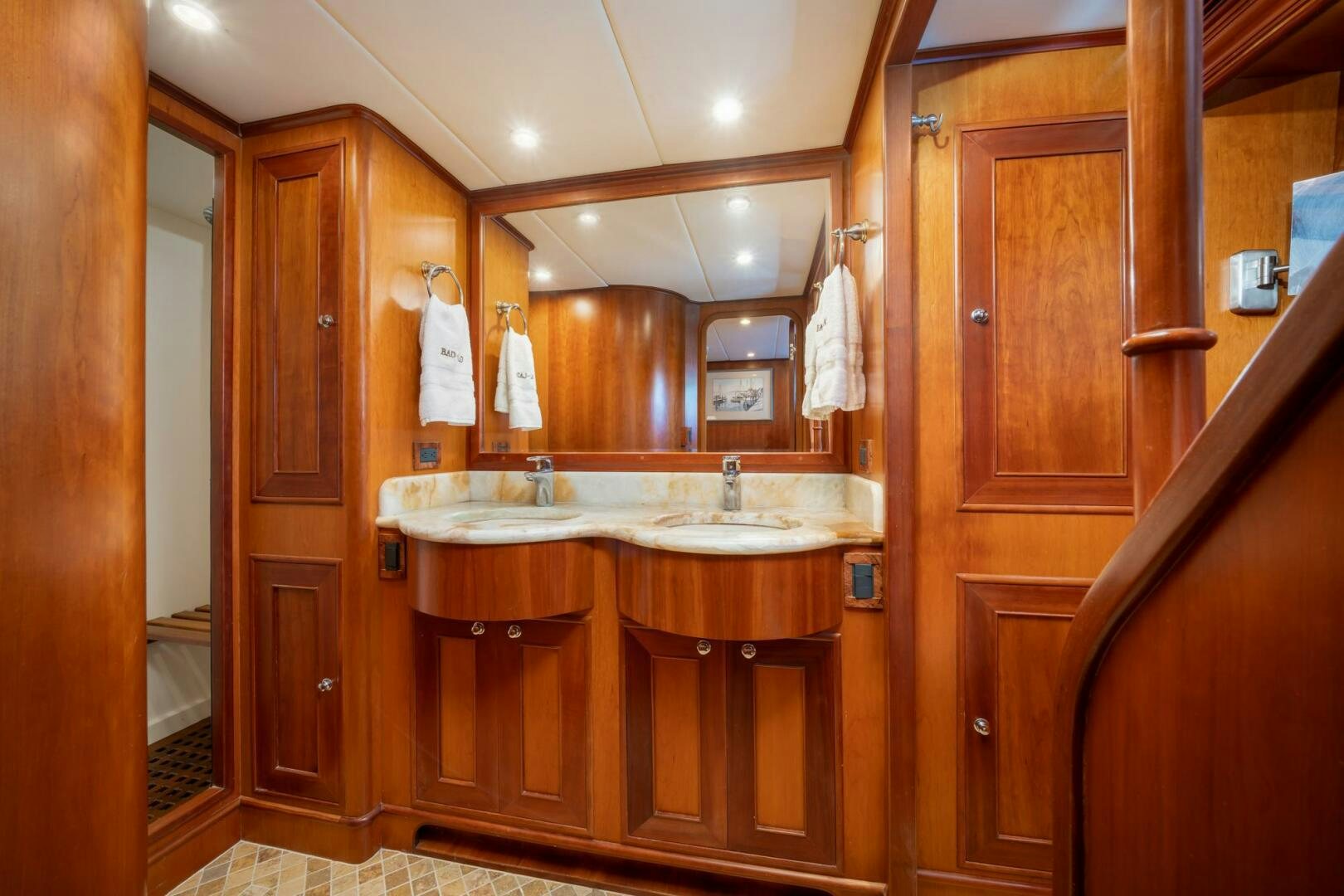 a bathroom with wooden cabinets aboard BAD-LAD Yacht for Sale