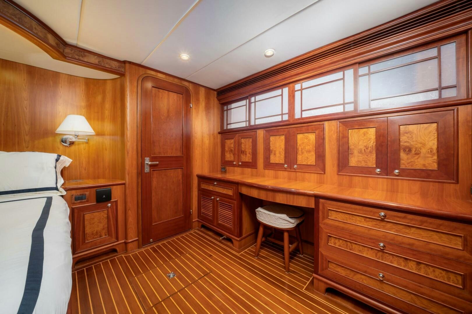 a kitchen with wooden cabinets aboard BAD-LAD Yacht for Sale