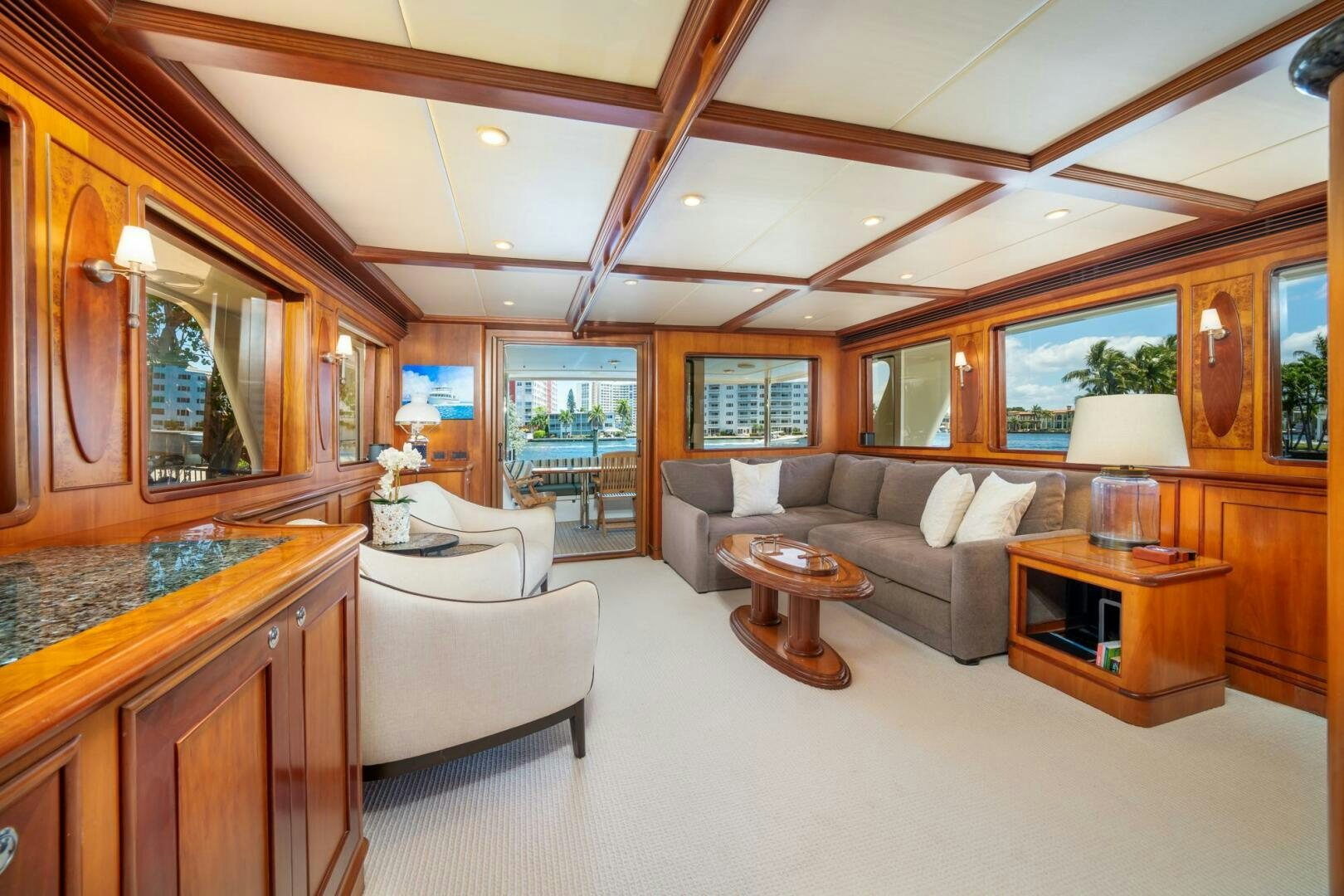 a living room with a large mirror aboard BAD-LAD Yacht for Sale