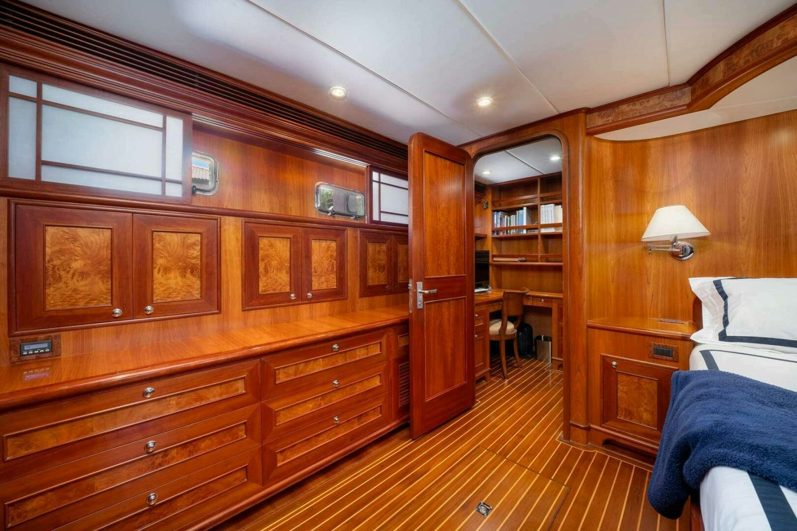 a room with wooden cabinets aboard BAD-LAD Yacht for Sale