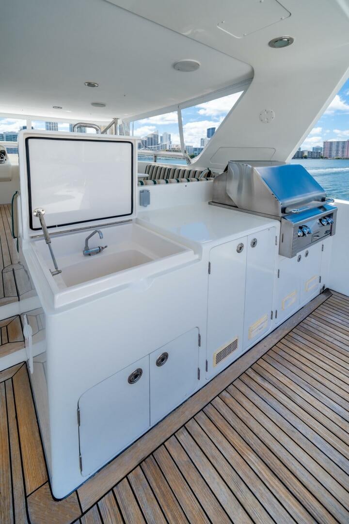 a room with a large window and a large television on the wall aboard BAD-LAD Yacht for Sale