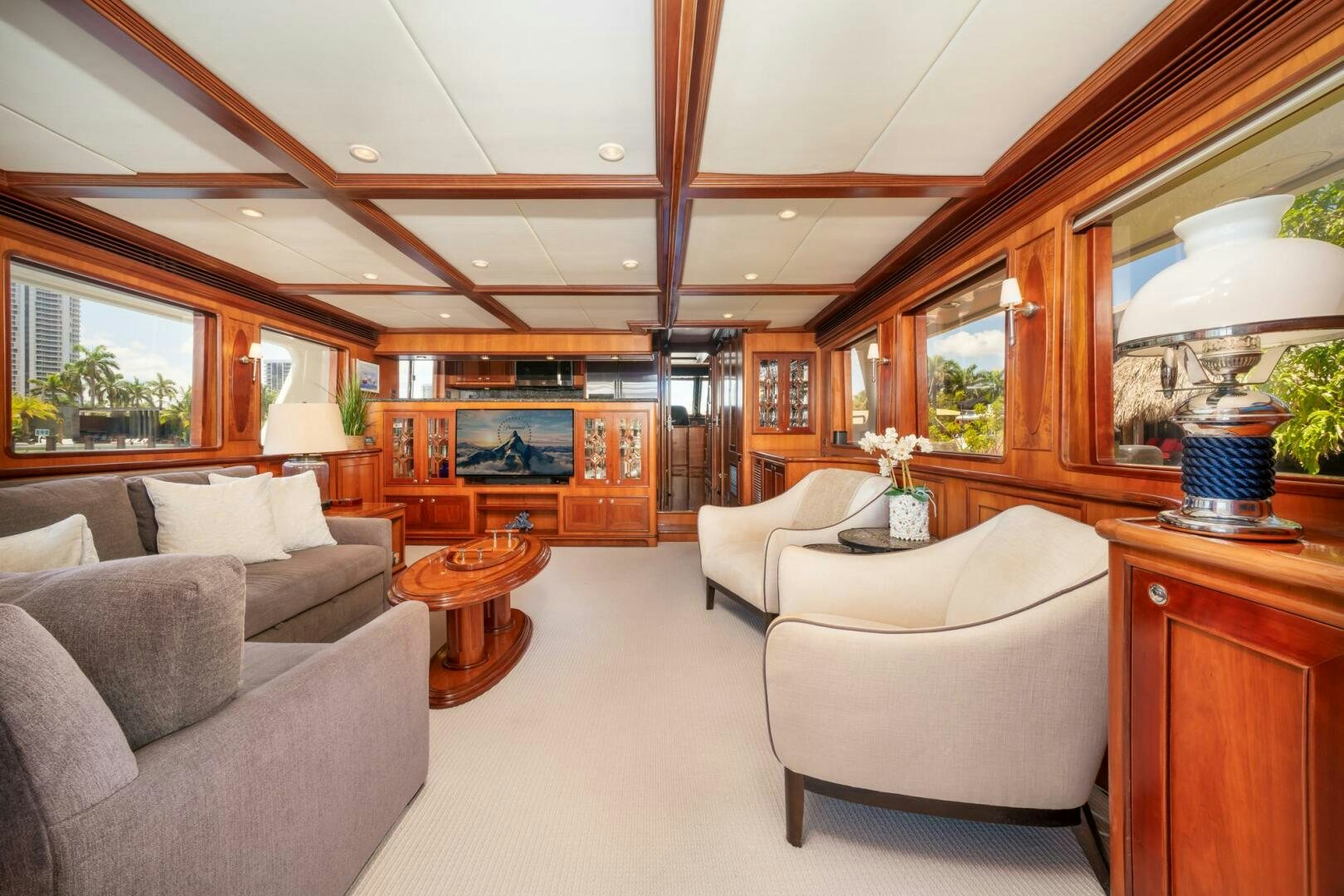 a living room with a large mirror aboard BAD-LAD Yacht for Sale
