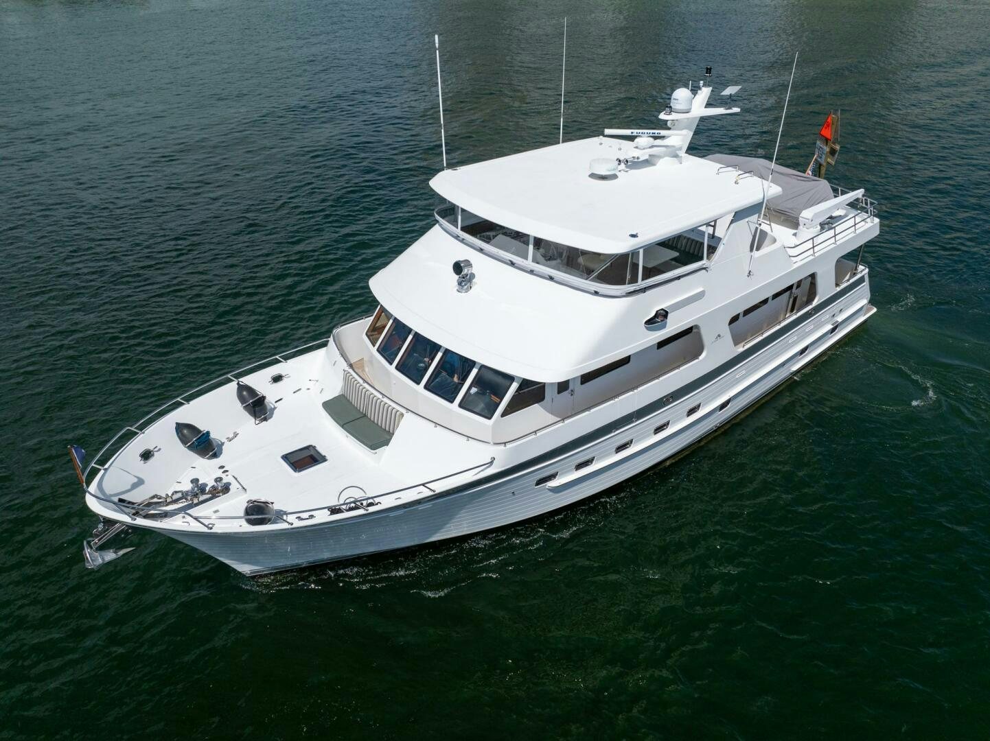 a white boat in the water aboard BAD-LAD Yacht for Sale