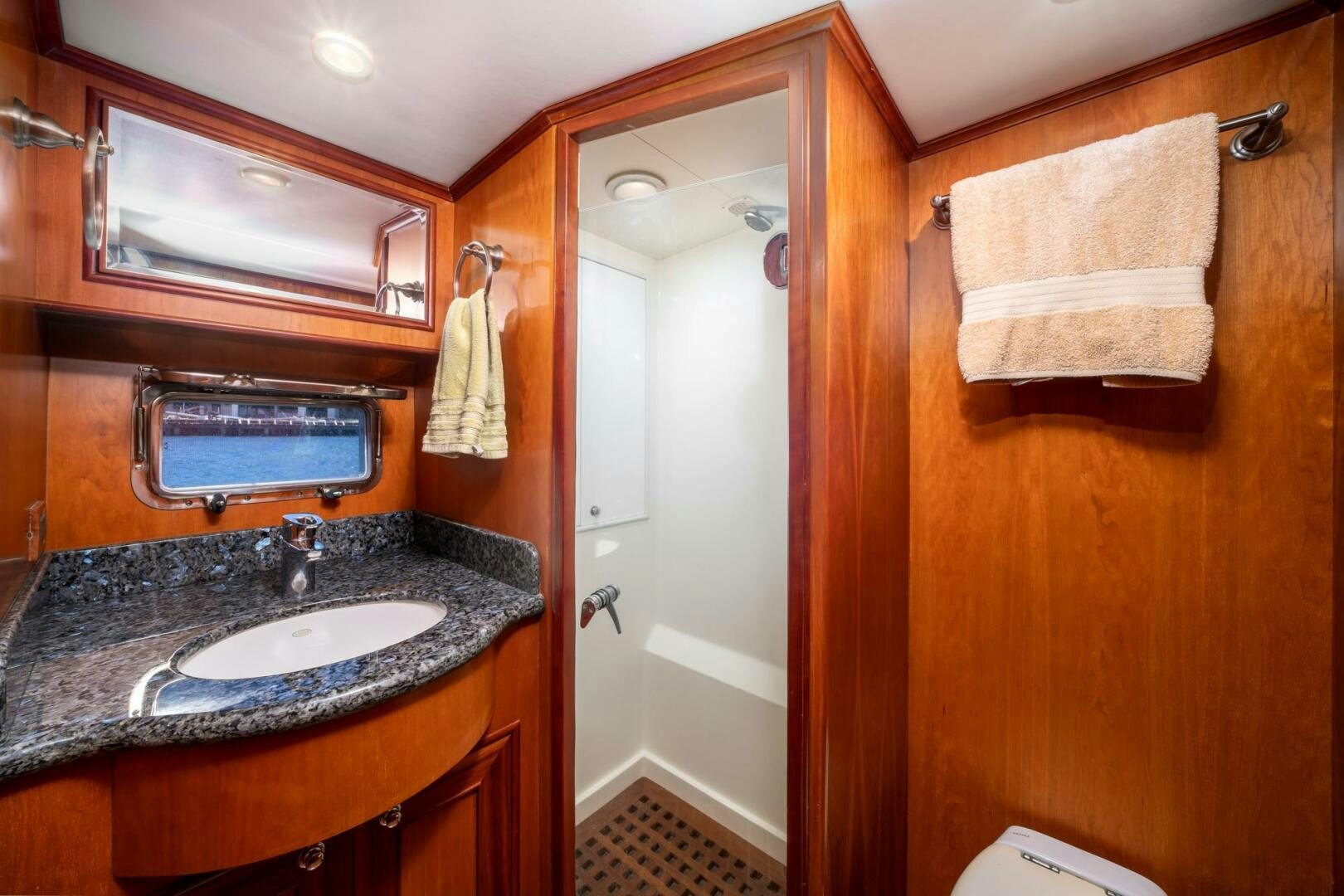 a bathroom with a sink and a mirror aboard BAD-LAD Yacht for Sale