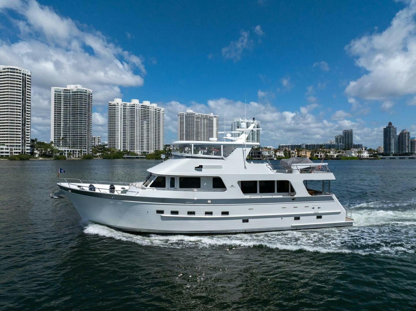 a white yacht in the water aboard BAD-LAD Yacht for Sale