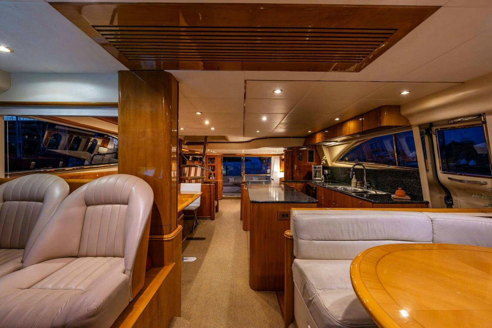 a room with a couch and a table aboard PEARL Yacht for Sale