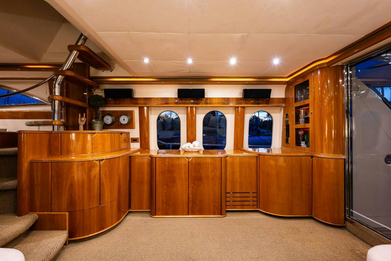 a room with wooden cabinets aboard PEARL Yacht for Sale