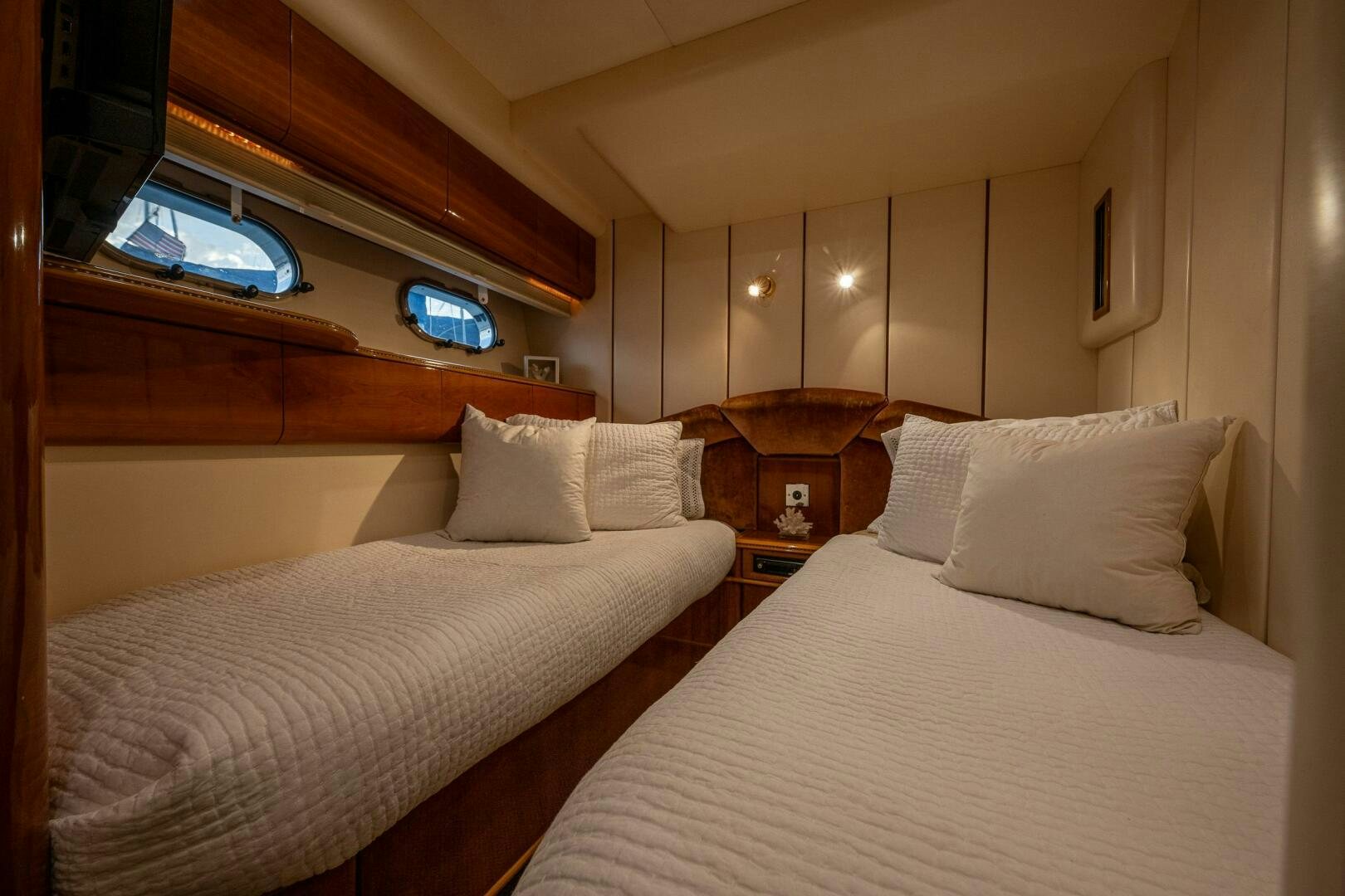 a room with two beds aboard PEARL Yacht for Sale