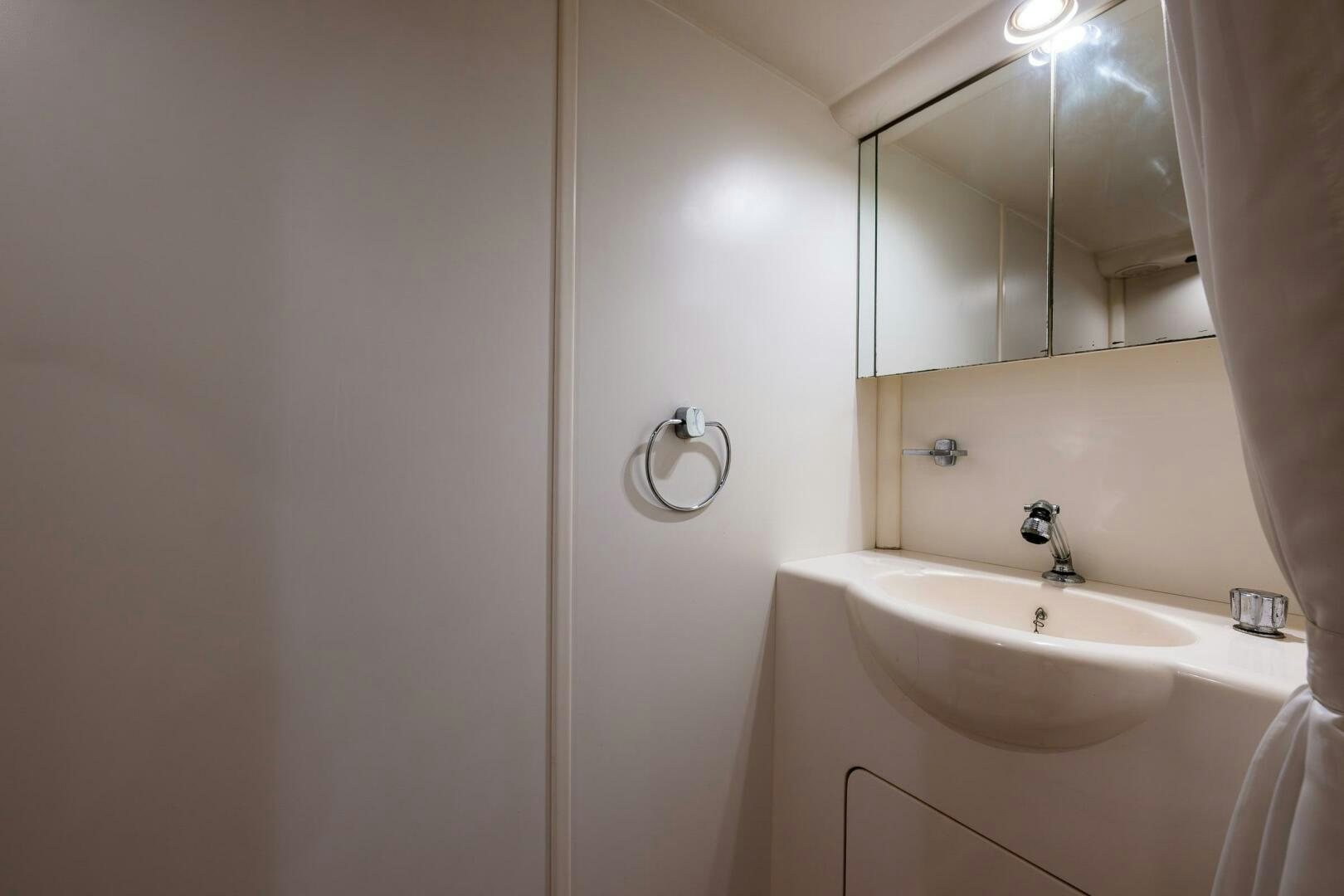 a bathroom with a sink and a mirror aboard PEARL Yacht for Sale