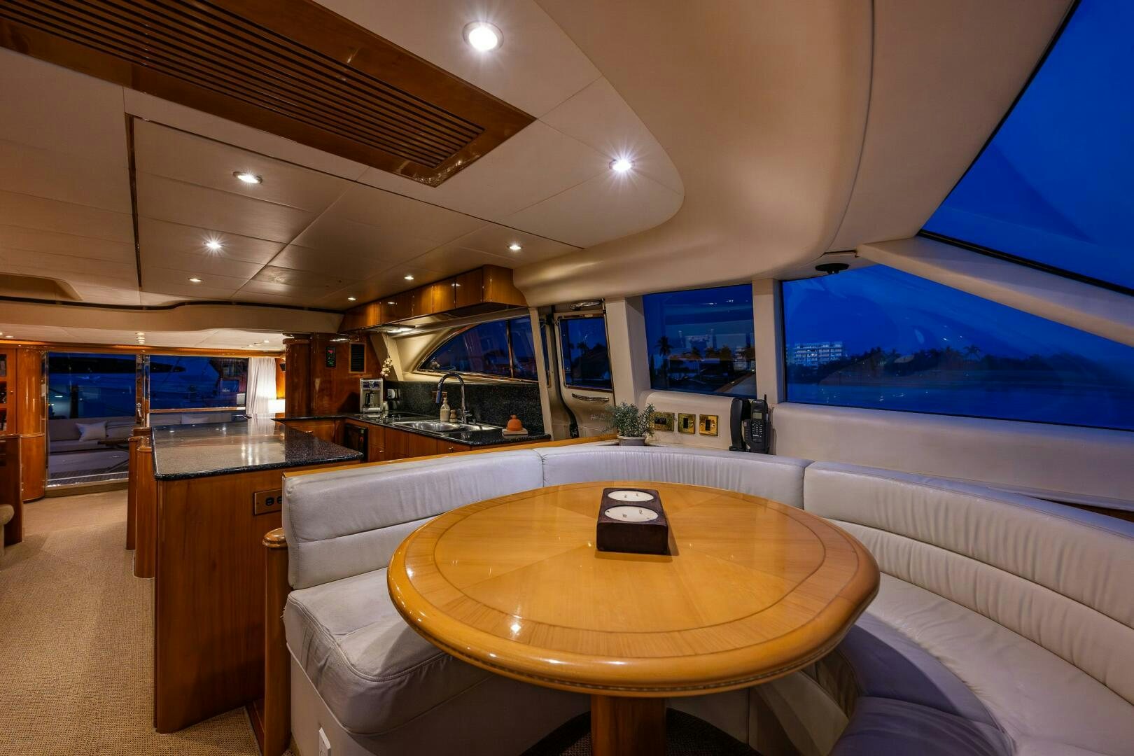 a room with a table and a chair aboard PEARL Yacht for Sale