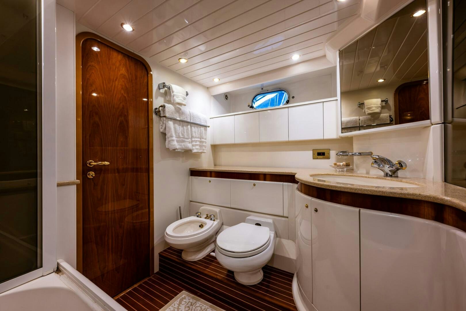 a bathroom with a toilet and a sink aboard PEARL Yacht for Sale