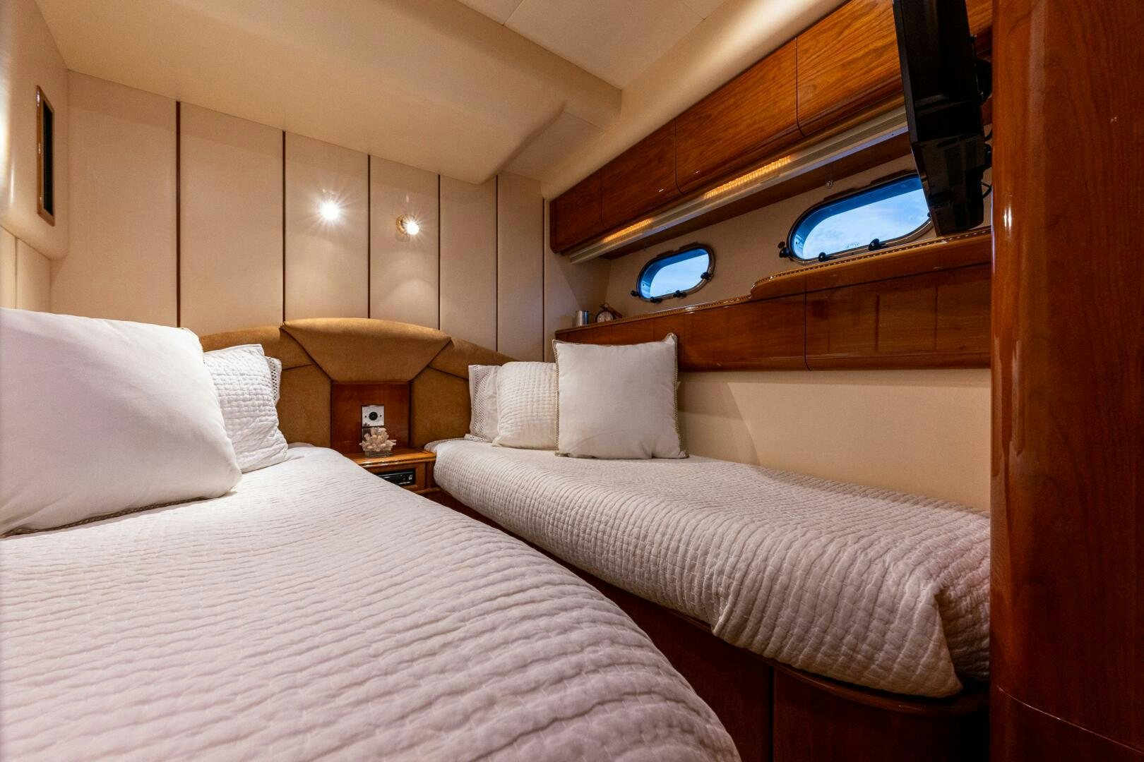 a room with two beds aboard PEARL Yacht for Sale