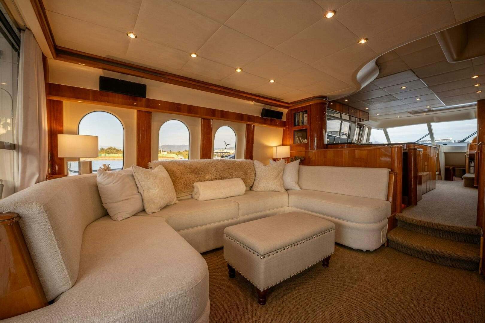 a room with couches and a window aboard PEARL Yacht for Sale