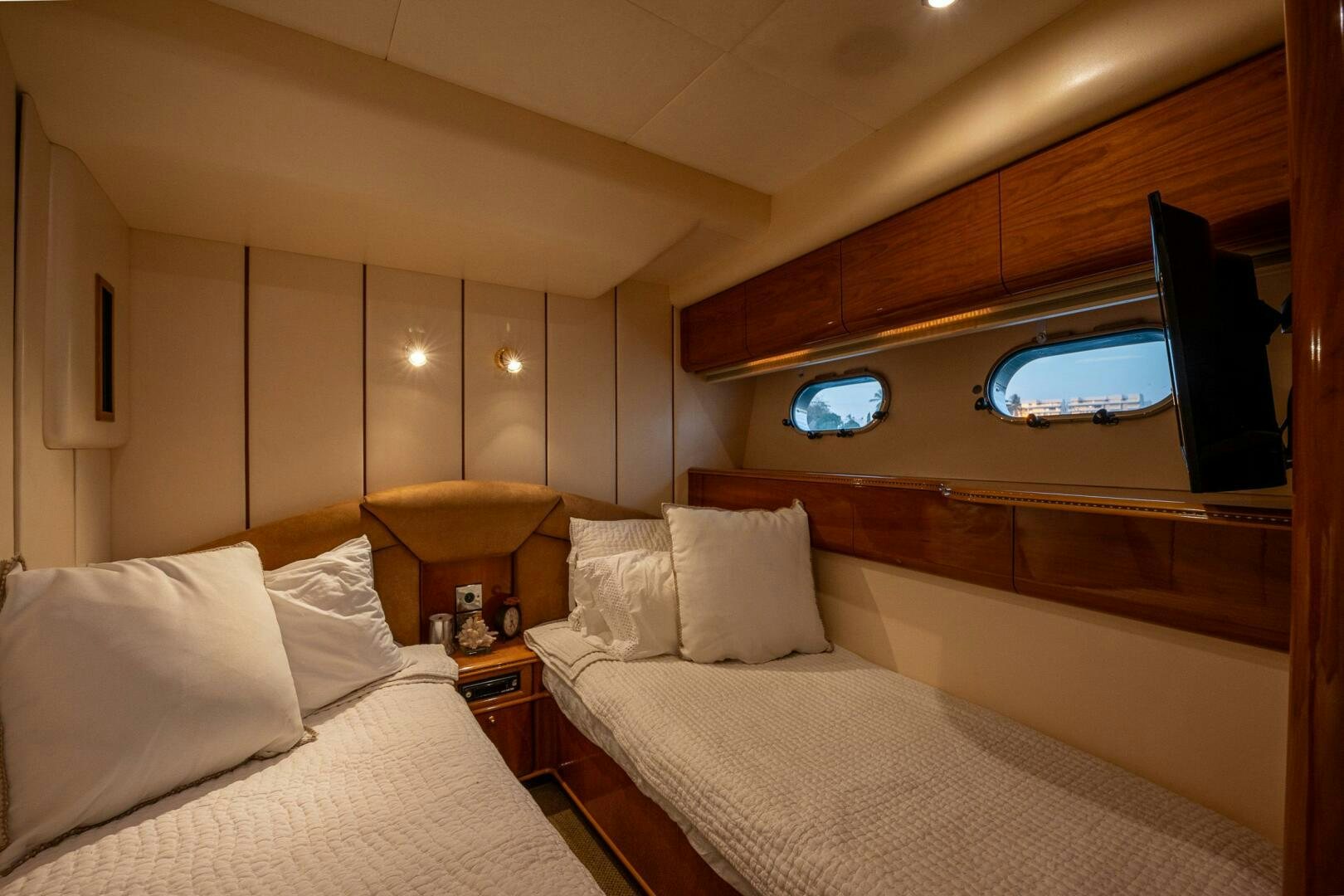 a room with two beds aboard PEARL Yacht for Sale