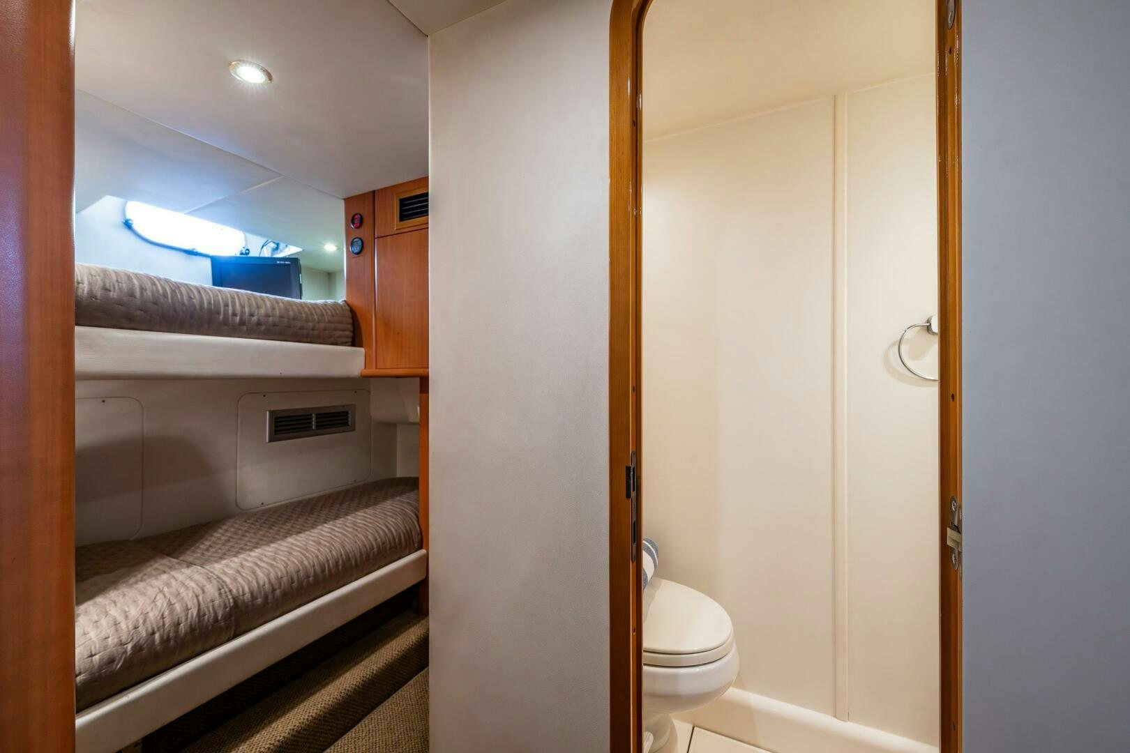 a bathroom with a bed and a closet aboard PEARL Yacht for Sale