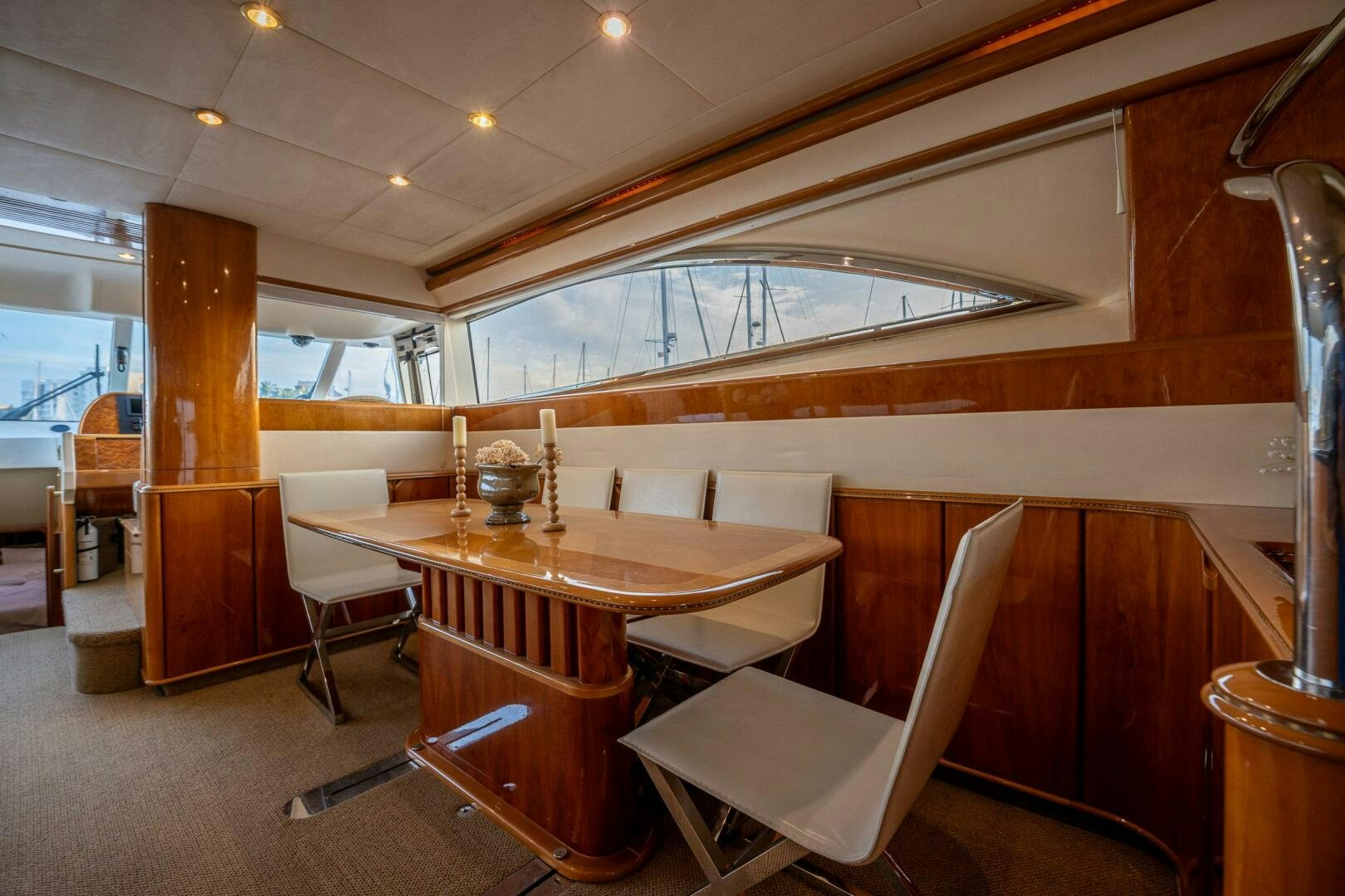 a room with a table and chairs aboard PEARL Yacht for Sale