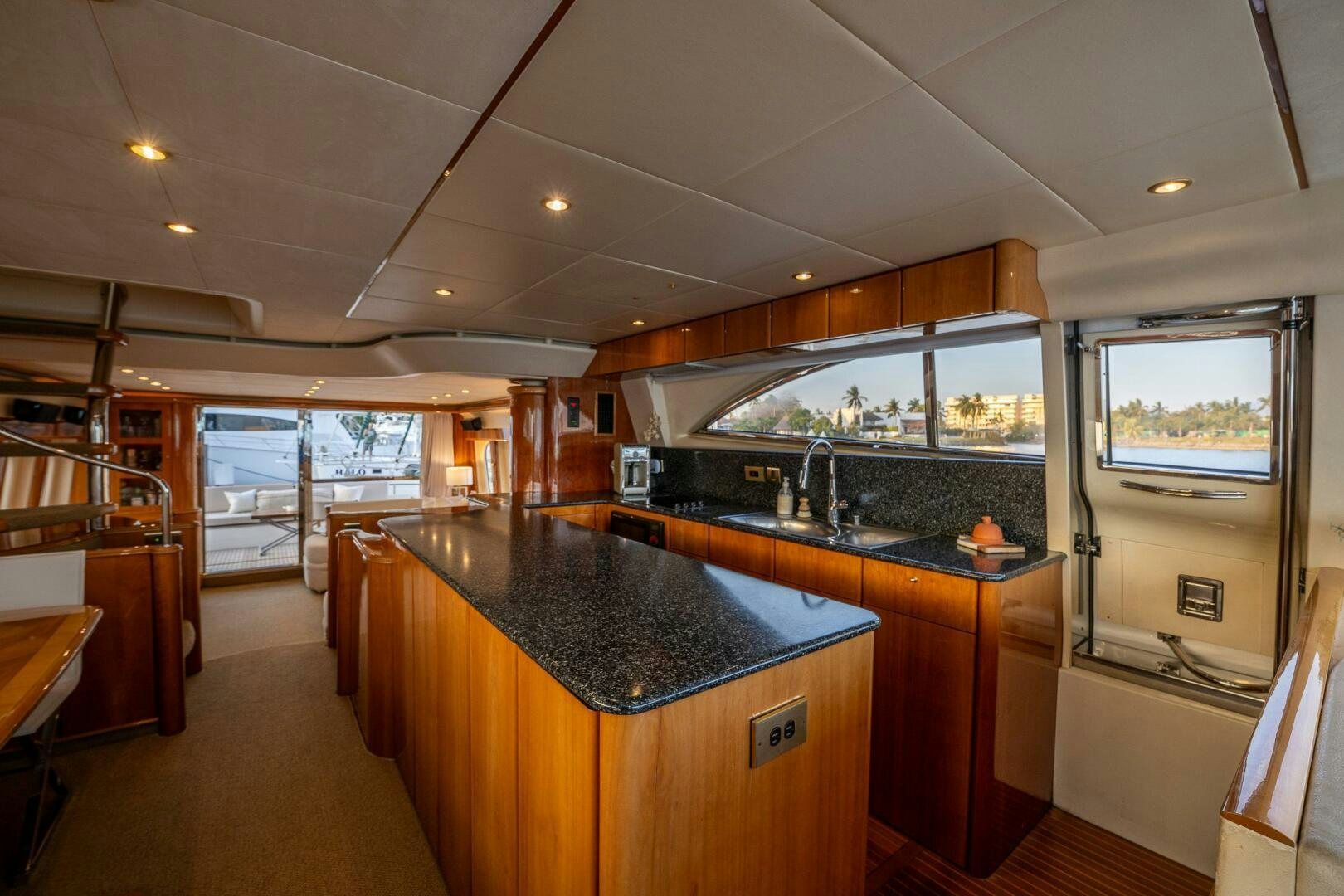 a kitchen with a large island aboard PEARL Yacht for Sale