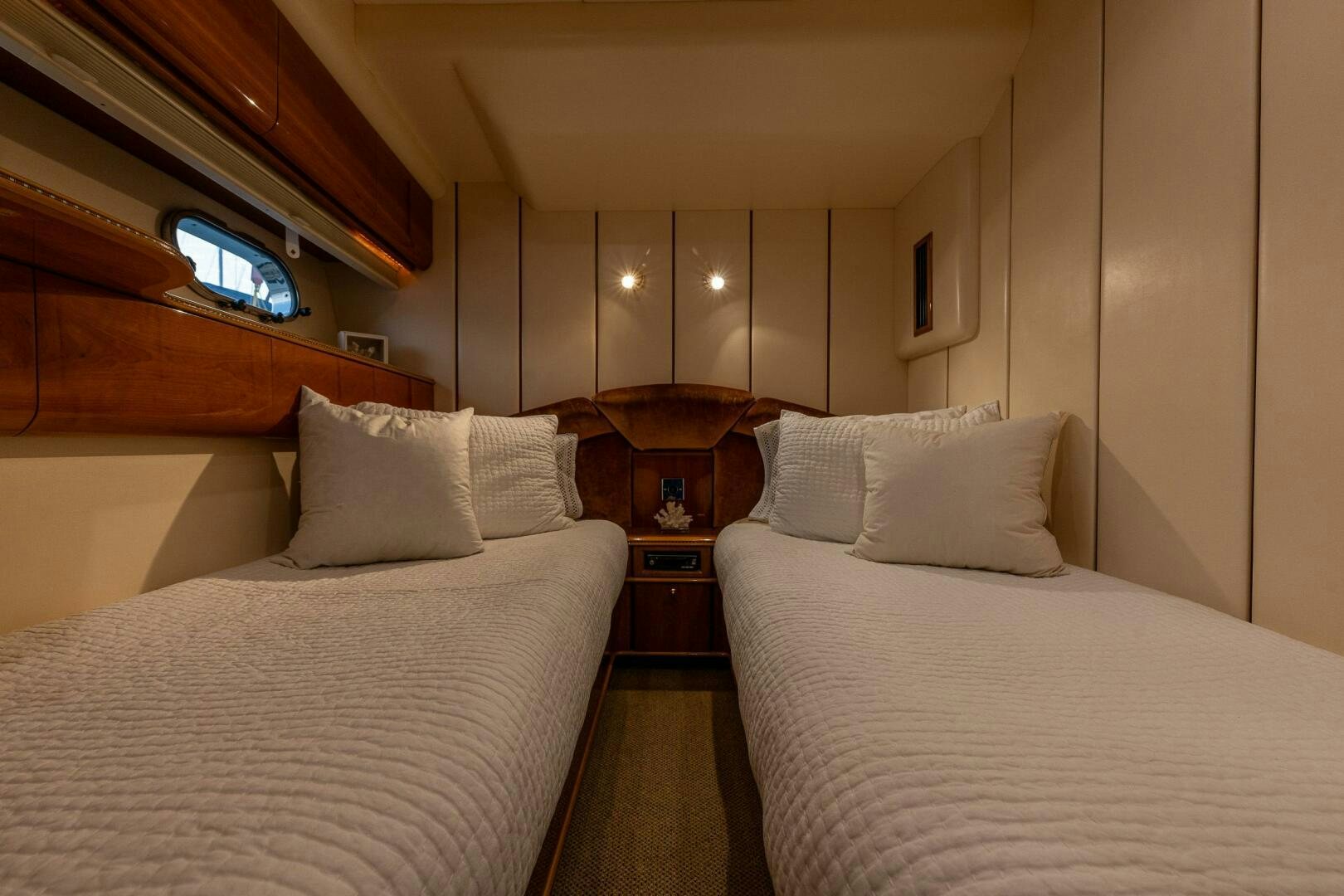 a couple of beds in a hotel room aboard PEARL Yacht for Sale