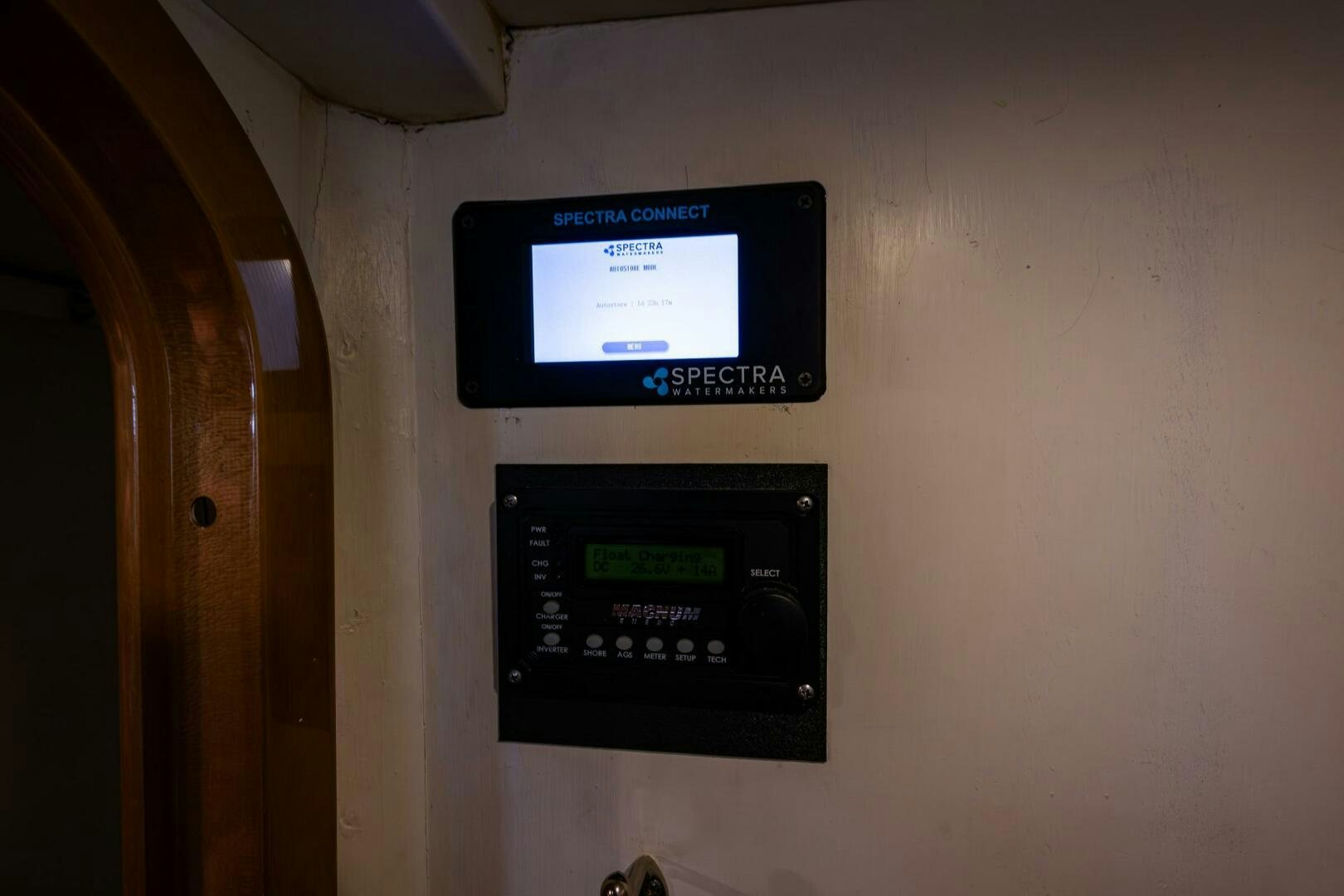 a rectangular electronic device on a wall aboard PEARL Yacht for Sale