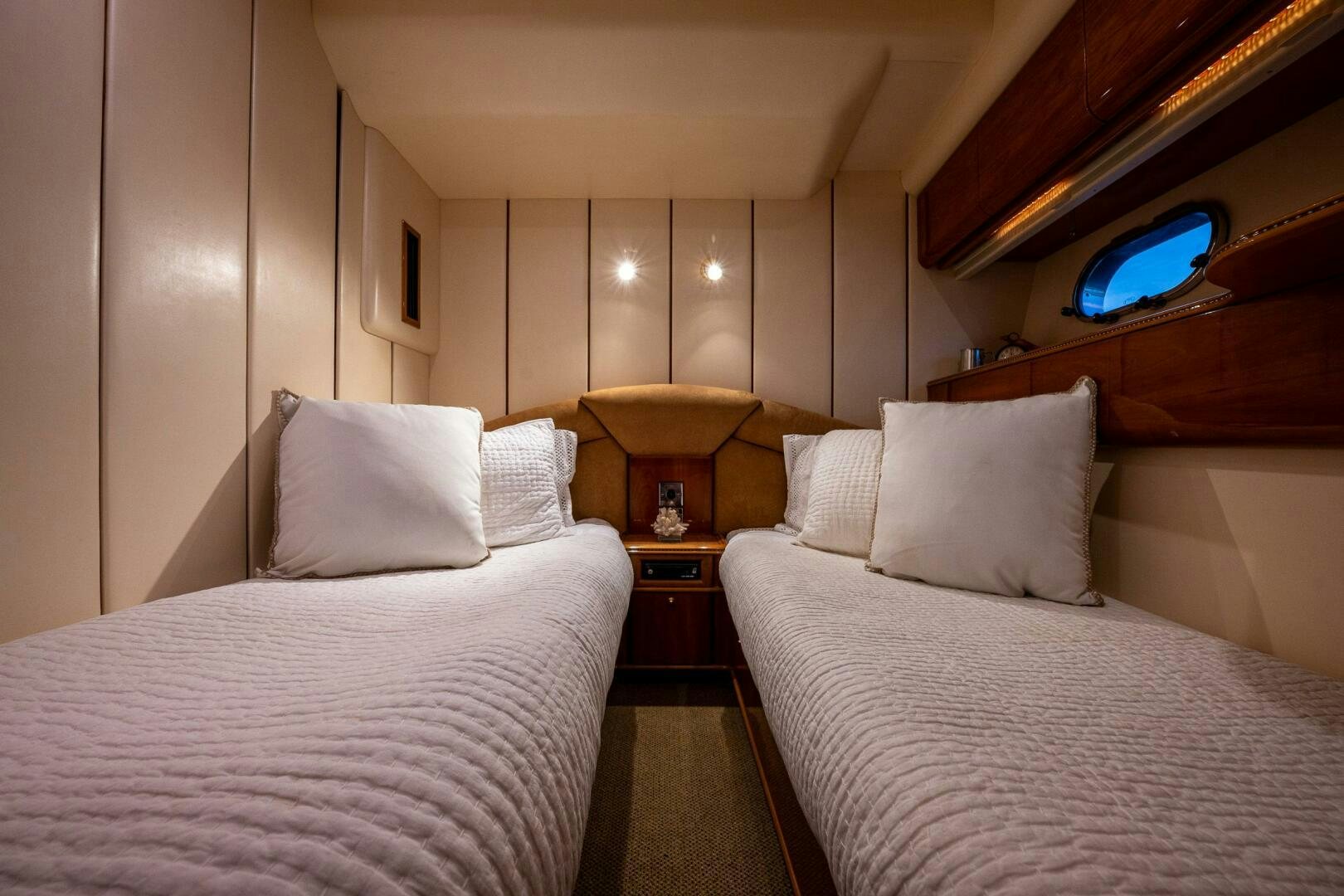 a room with two beds aboard PEARL Yacht for Sale