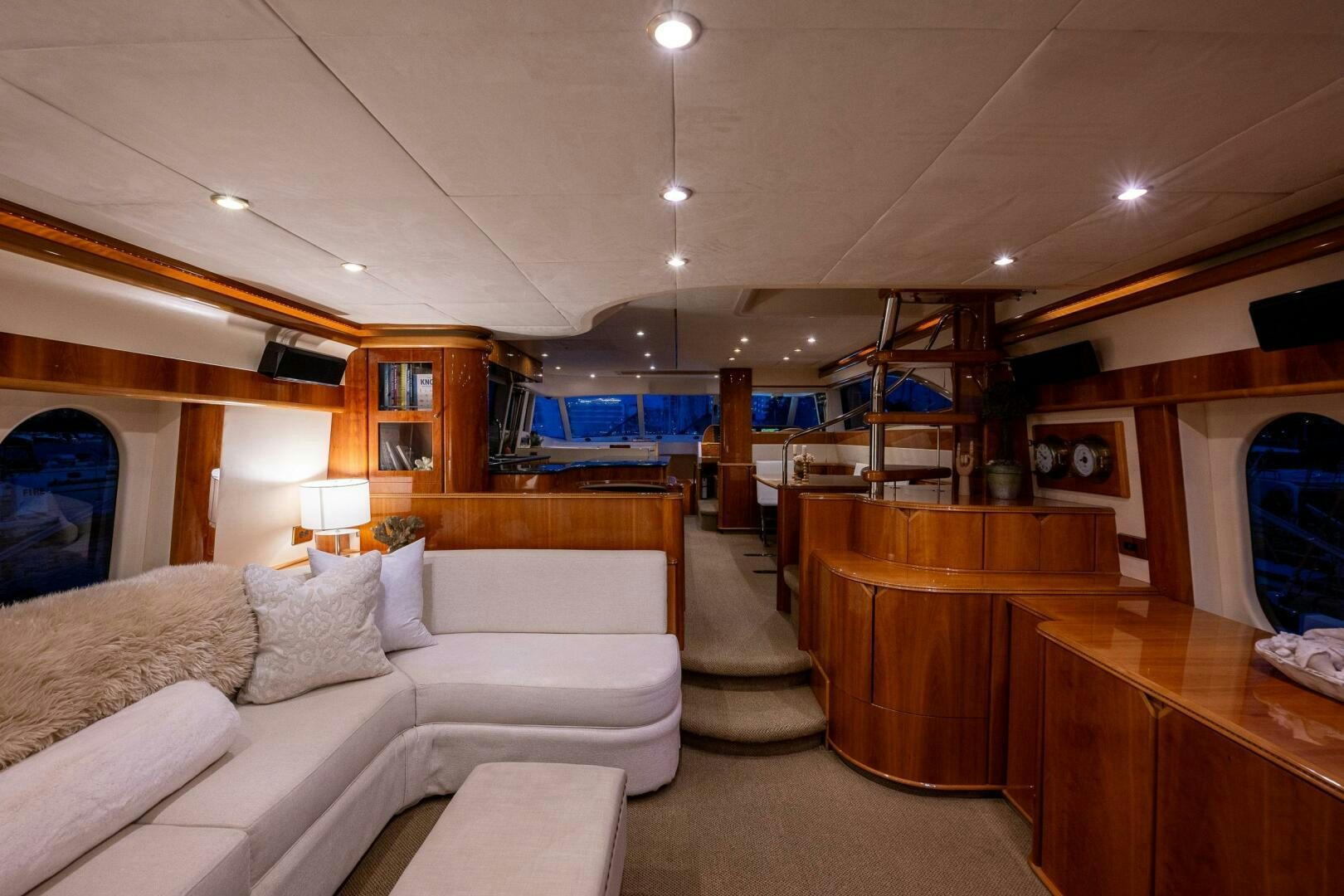 a living room with a large mirror aboard PEARL Yacht for Sale