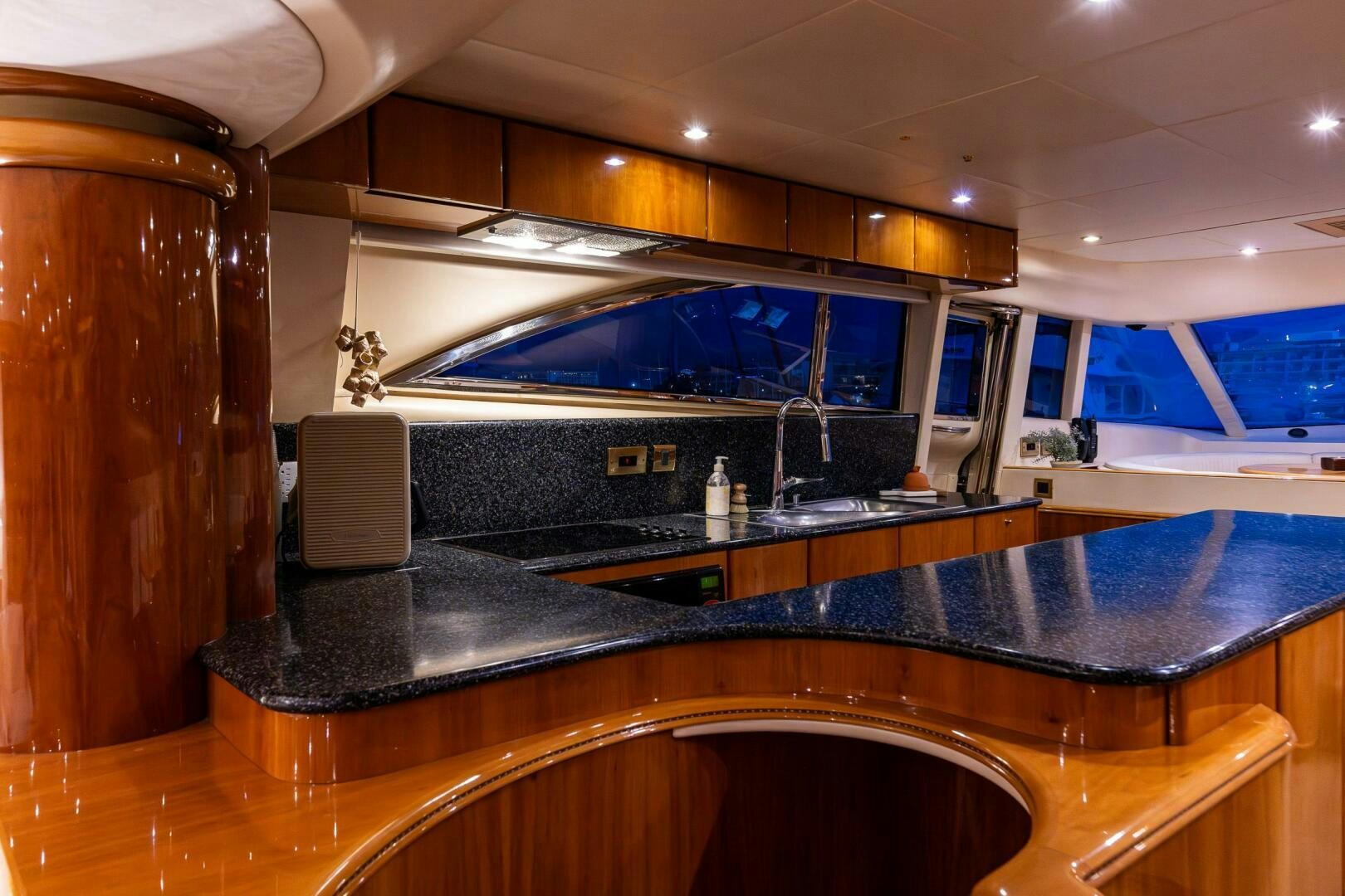 a kitchen with a large island aboard PEARL Yacht for Sale