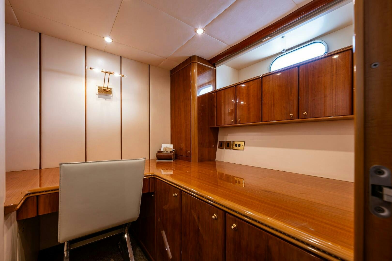 a kitchen with wooden cabinets aboard PEARL Yacht for Sale