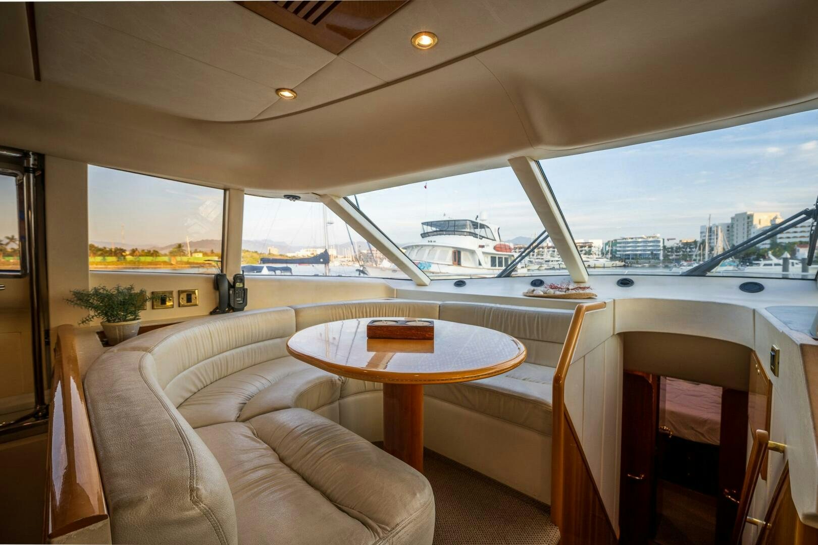 a room with a table and chairs aboard PEARL Yacht for Sale
