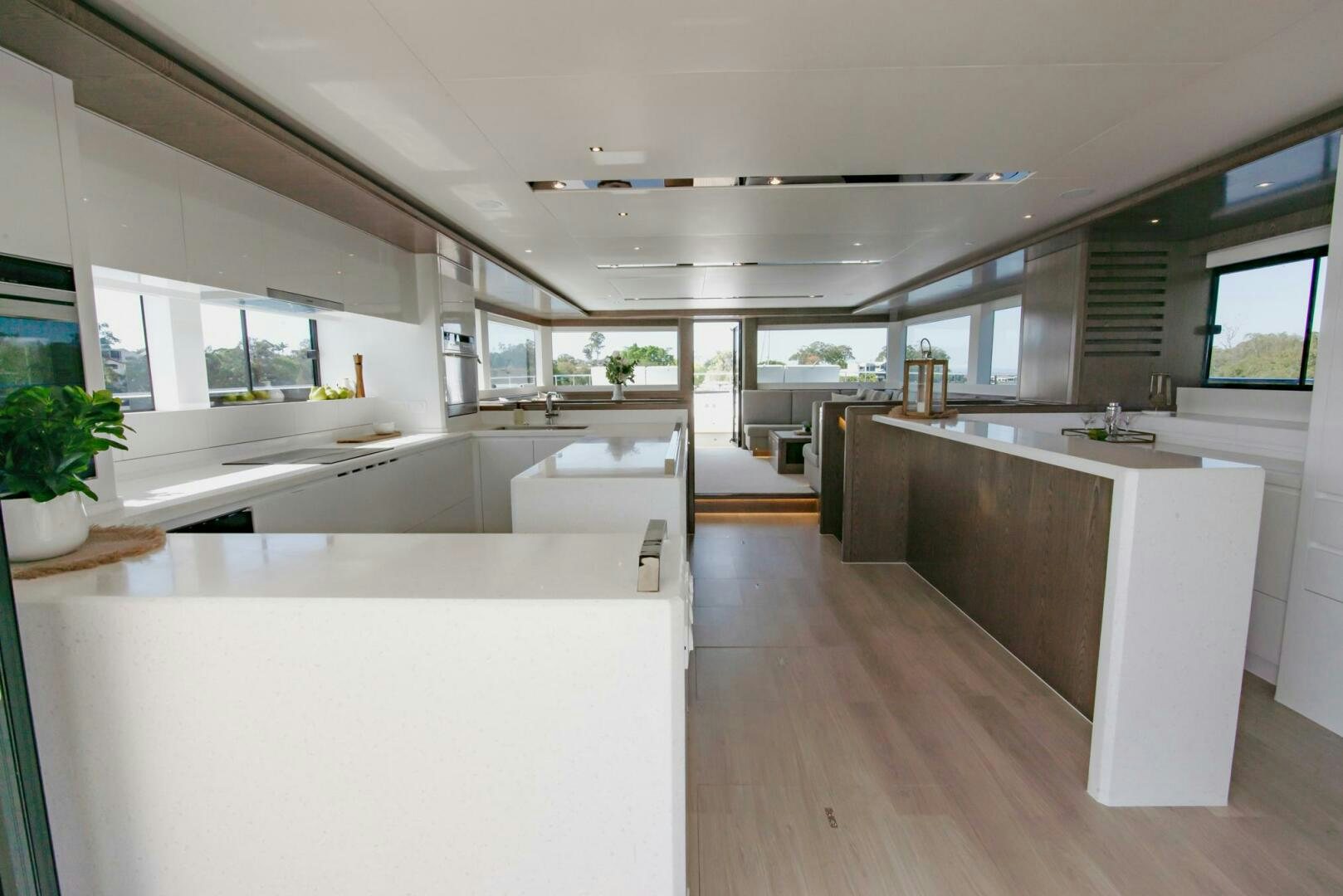 a modern kitchen with white cabinets aboard NONE Yacht for Sale