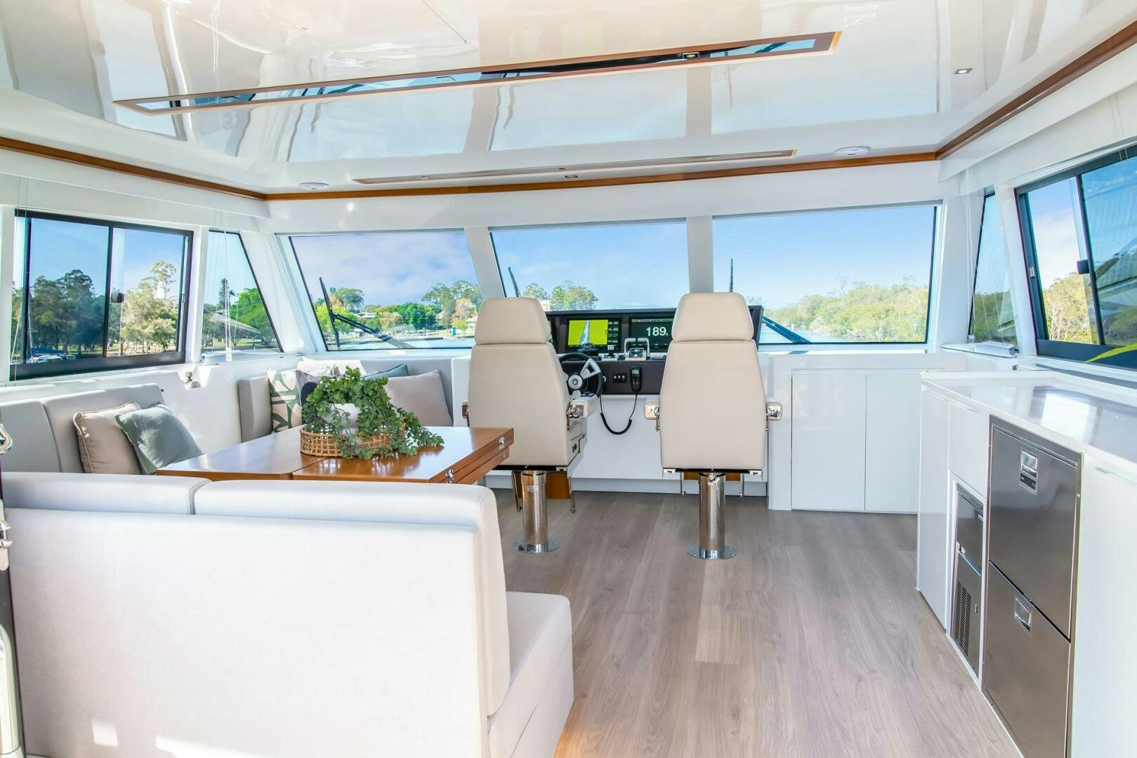 a room with a couch and a table and chairs aboard NONE Yacht for Sale