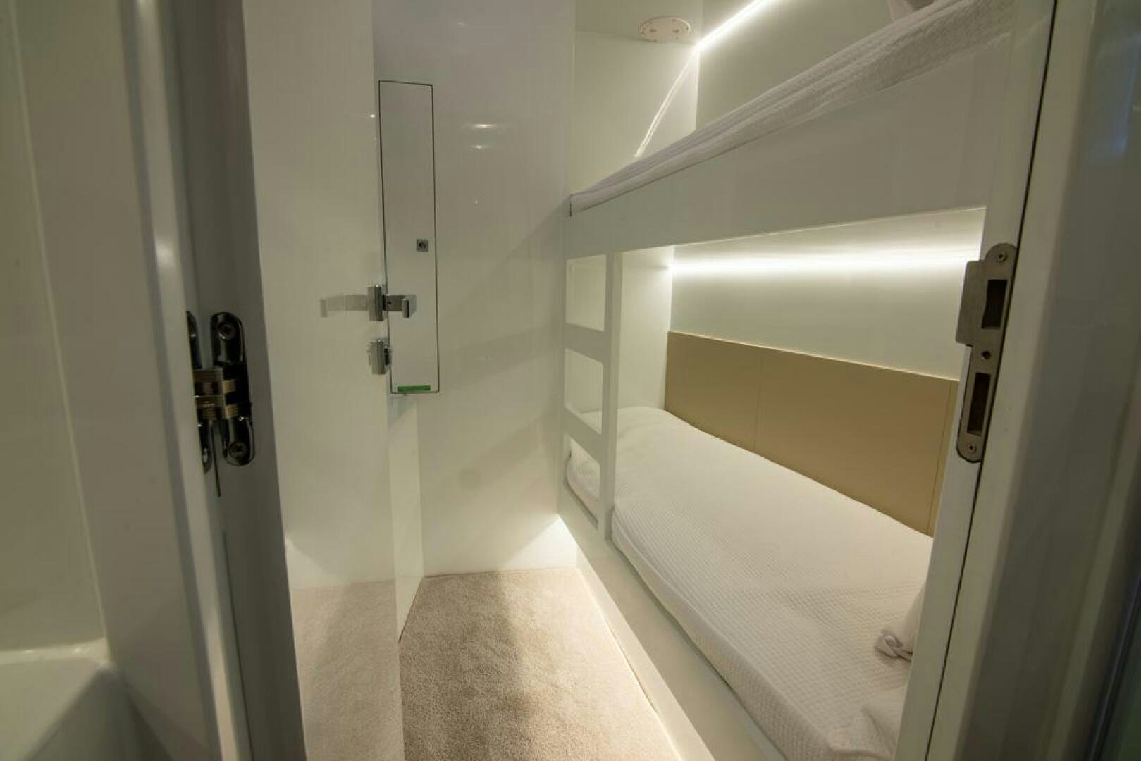 a white bathroom with a white door aboard NONE Yacht for Sale