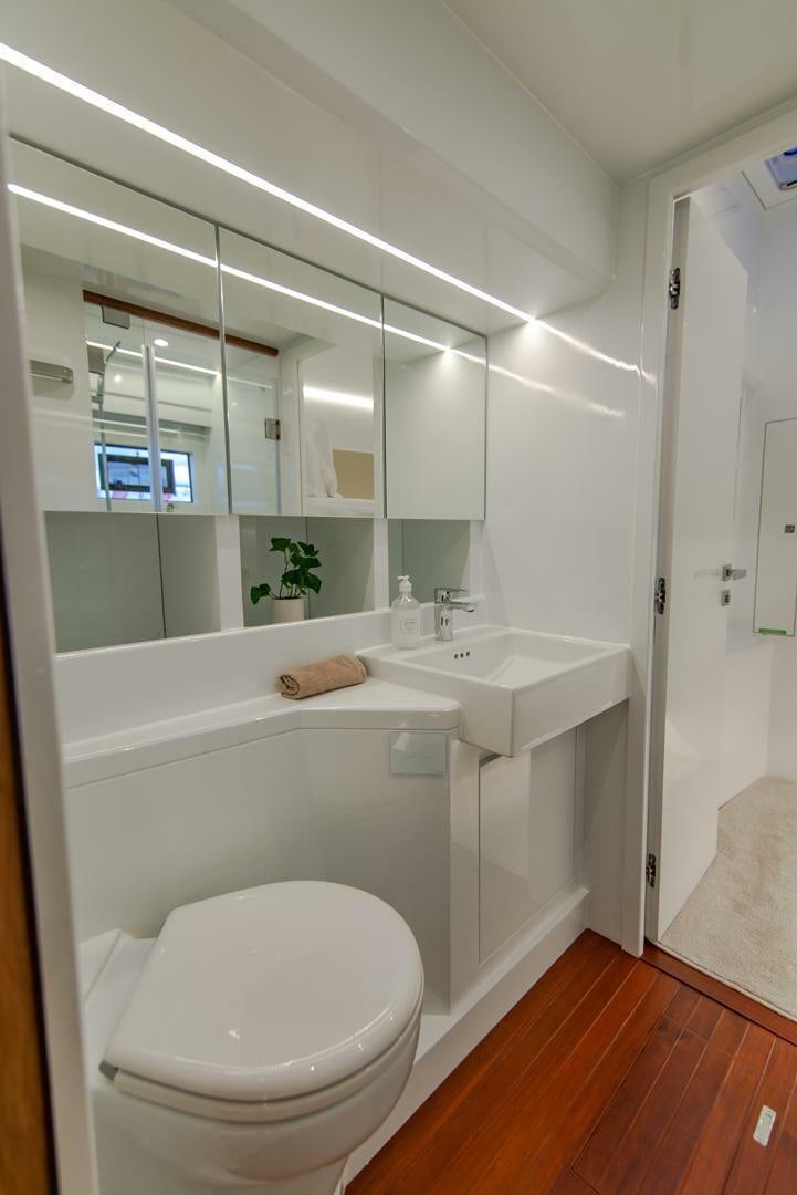 a bathroom with a tub sink and toilet aboard NONE Yacht for Sale