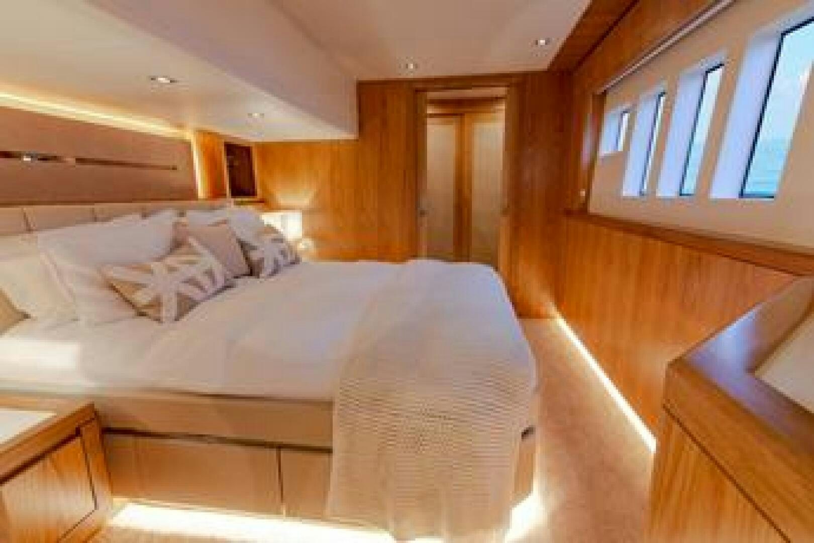 a room with a bed and a window aboard NONE Yacht for Sale