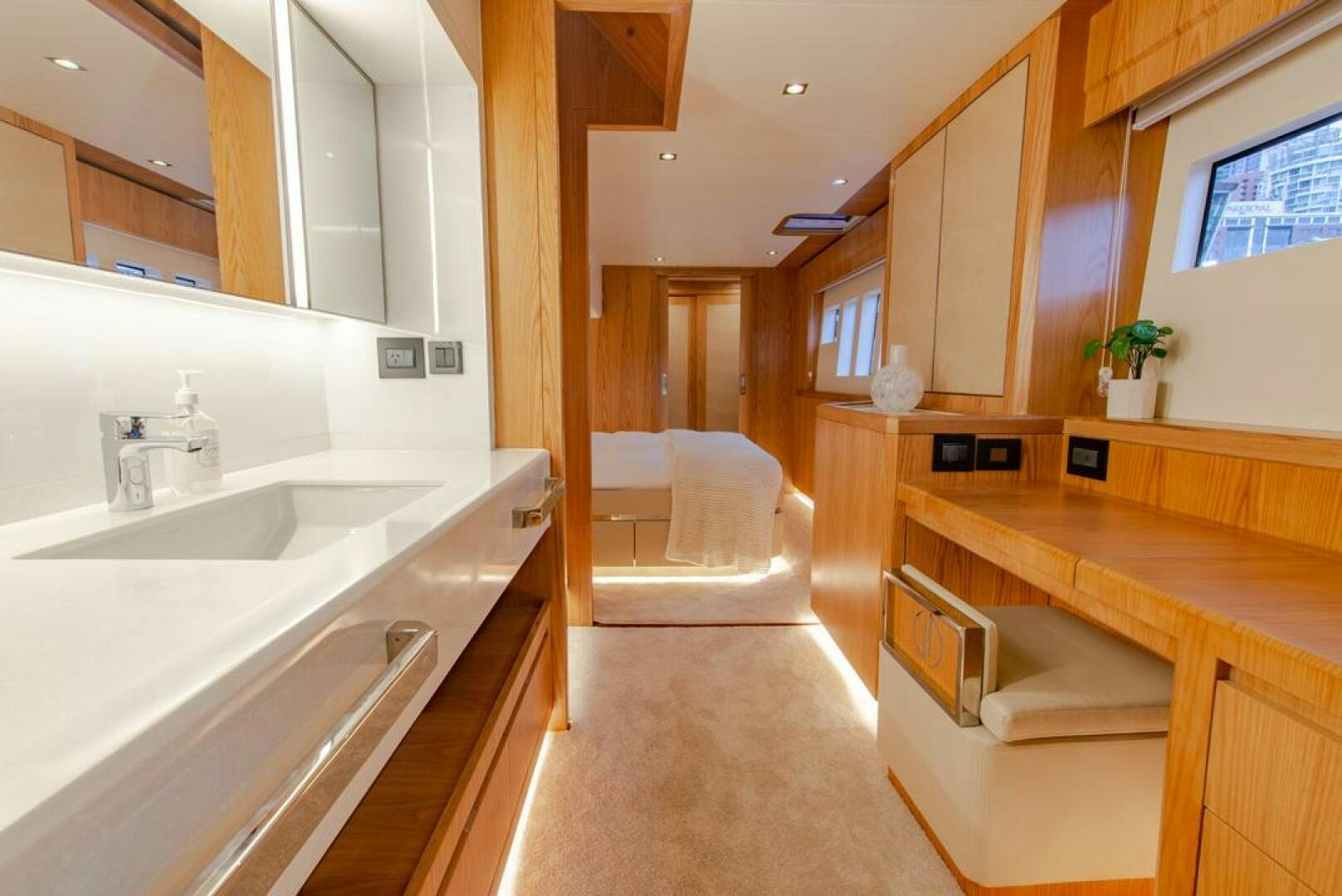 a bathroom with a sink and a bed aboard NONE Yacht for Sale