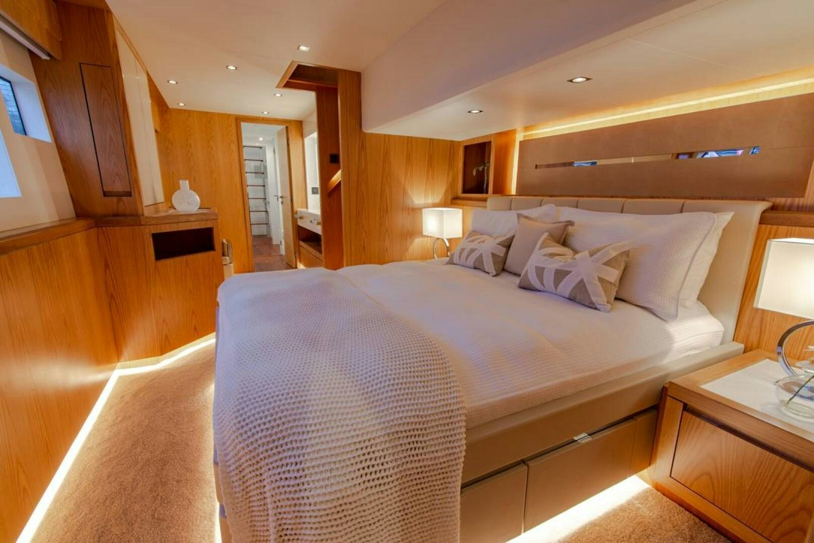 a bed with a white sheet aboard NONE Yacht for Sale
