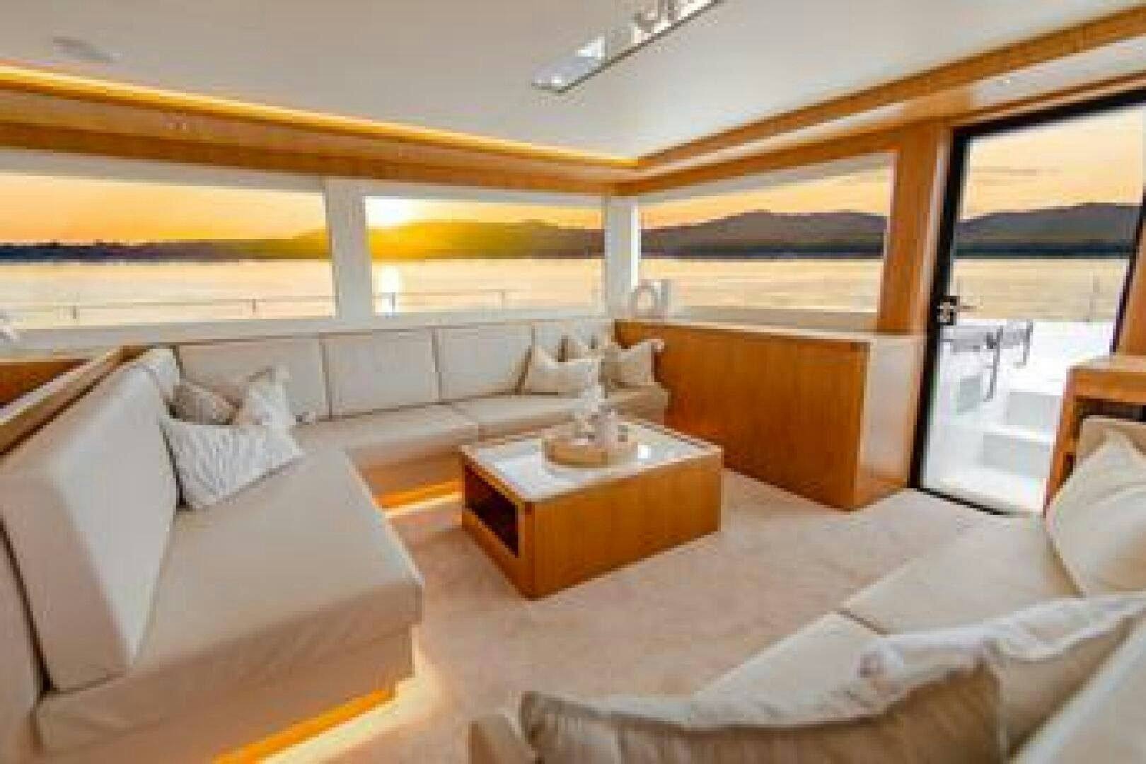 a room with a bed and a table aboard NONE Yacht for Sale