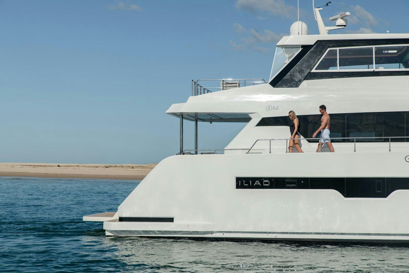 a couple walking on a boat aboard NONE Yacht for Sale